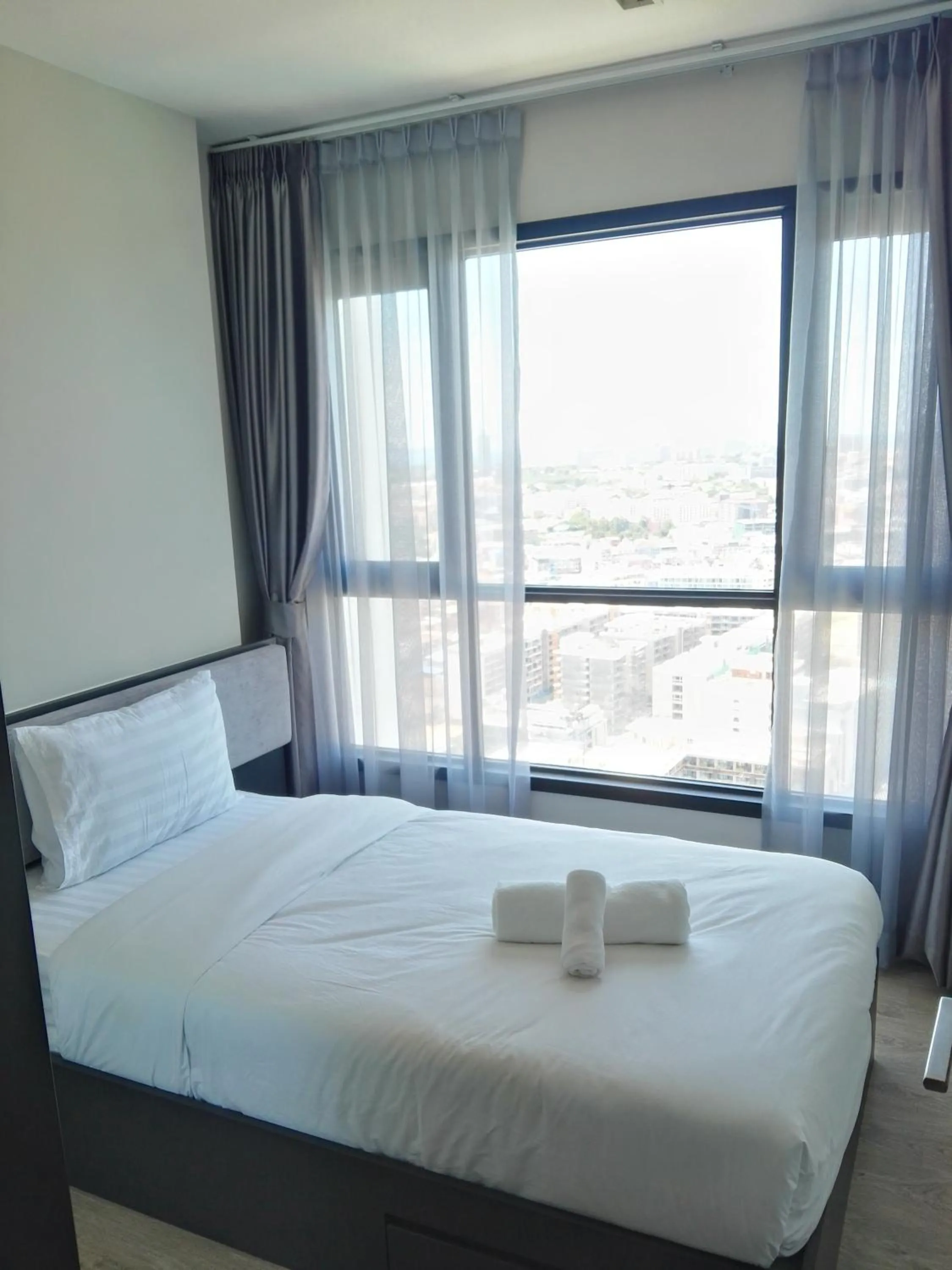 Bed in LLX Apartments at The Base condo