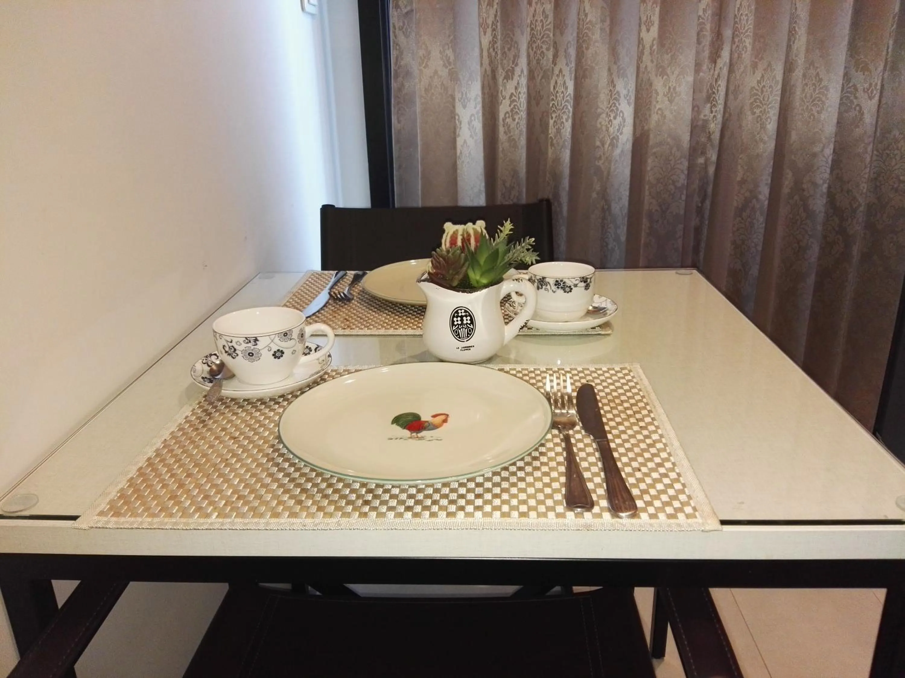 Dining area in LLX Apartments at The Base condo
