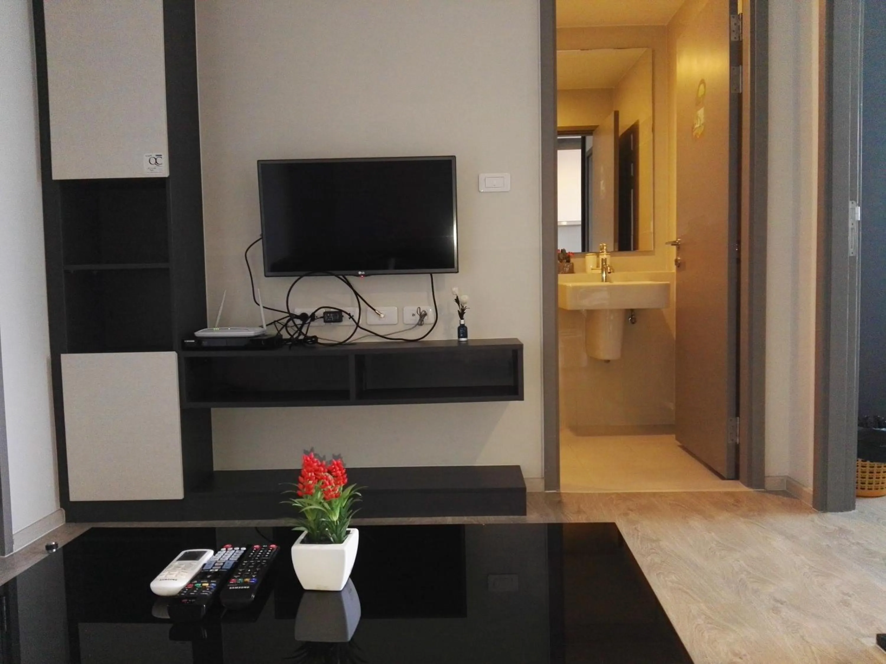 Living room in LLX Apartments at The Base condo