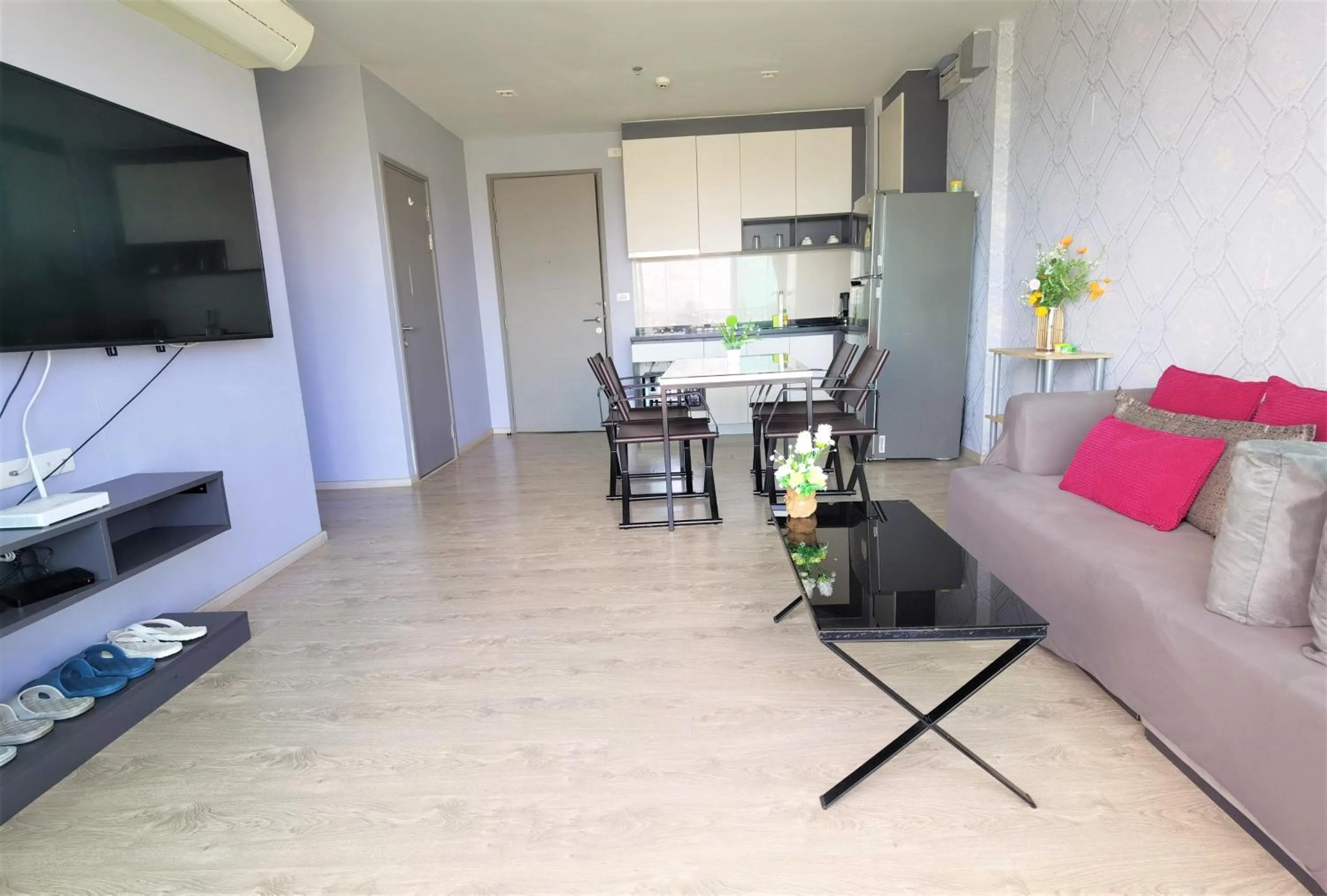 Living room in LLX Apartments at The Base condo