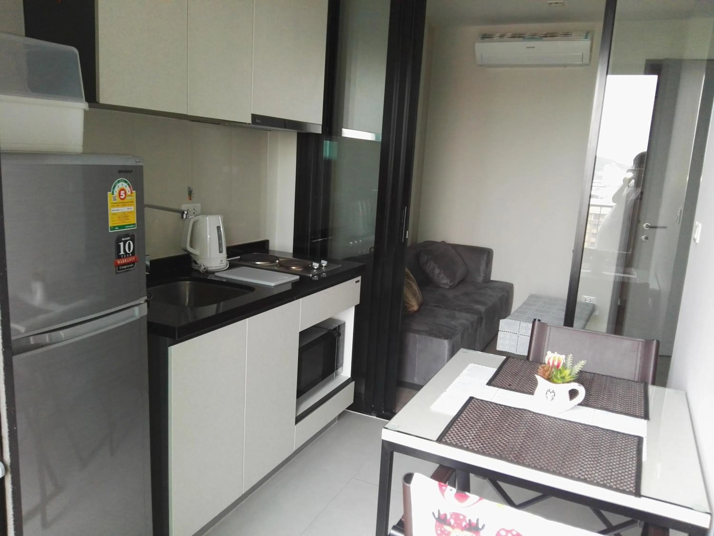 Kitchen or kitchenette in LLX Apartments at The Base condo