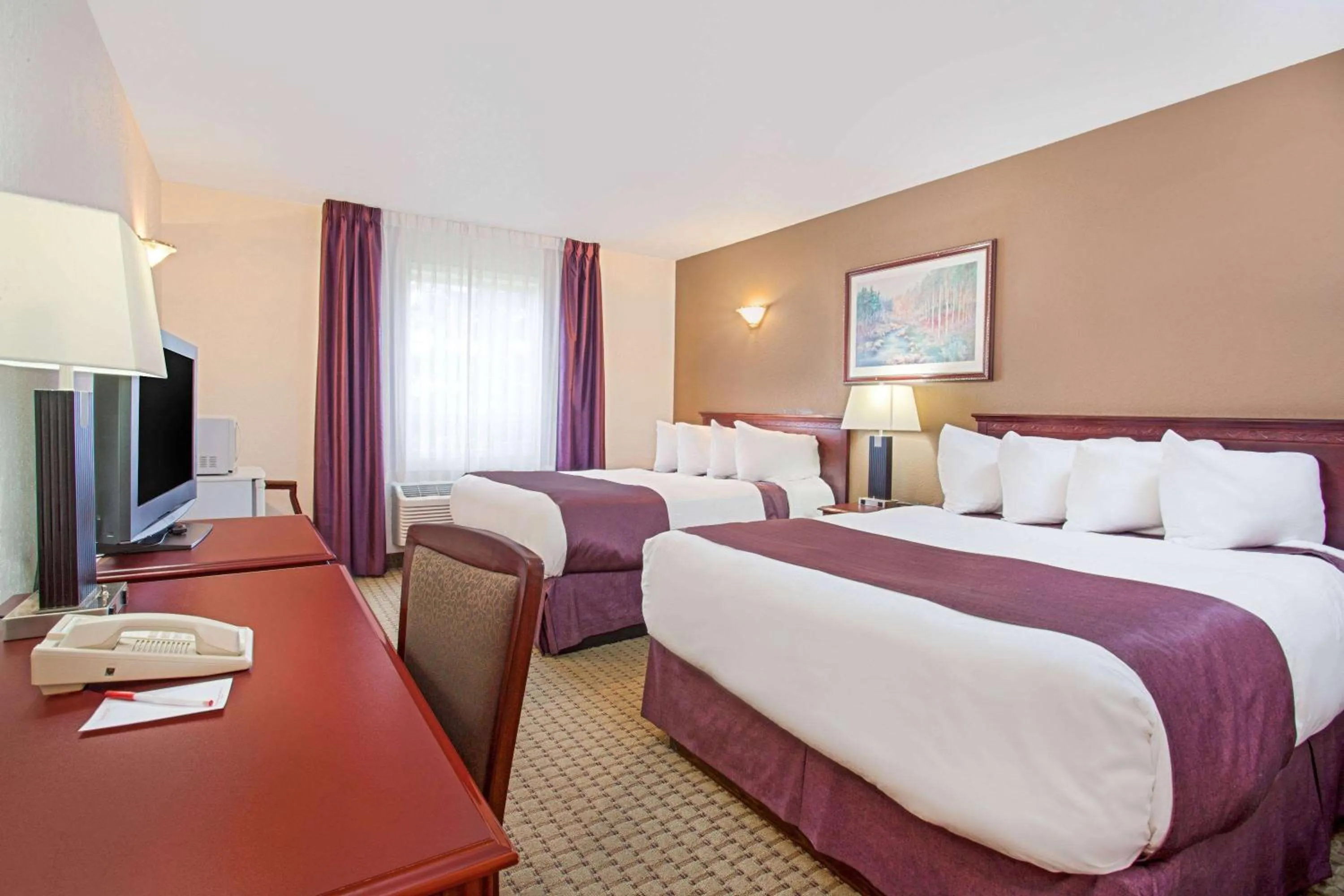 Photo of the whole room, Bed in Ramada by Wyndham Red Deer Hotel & Suites