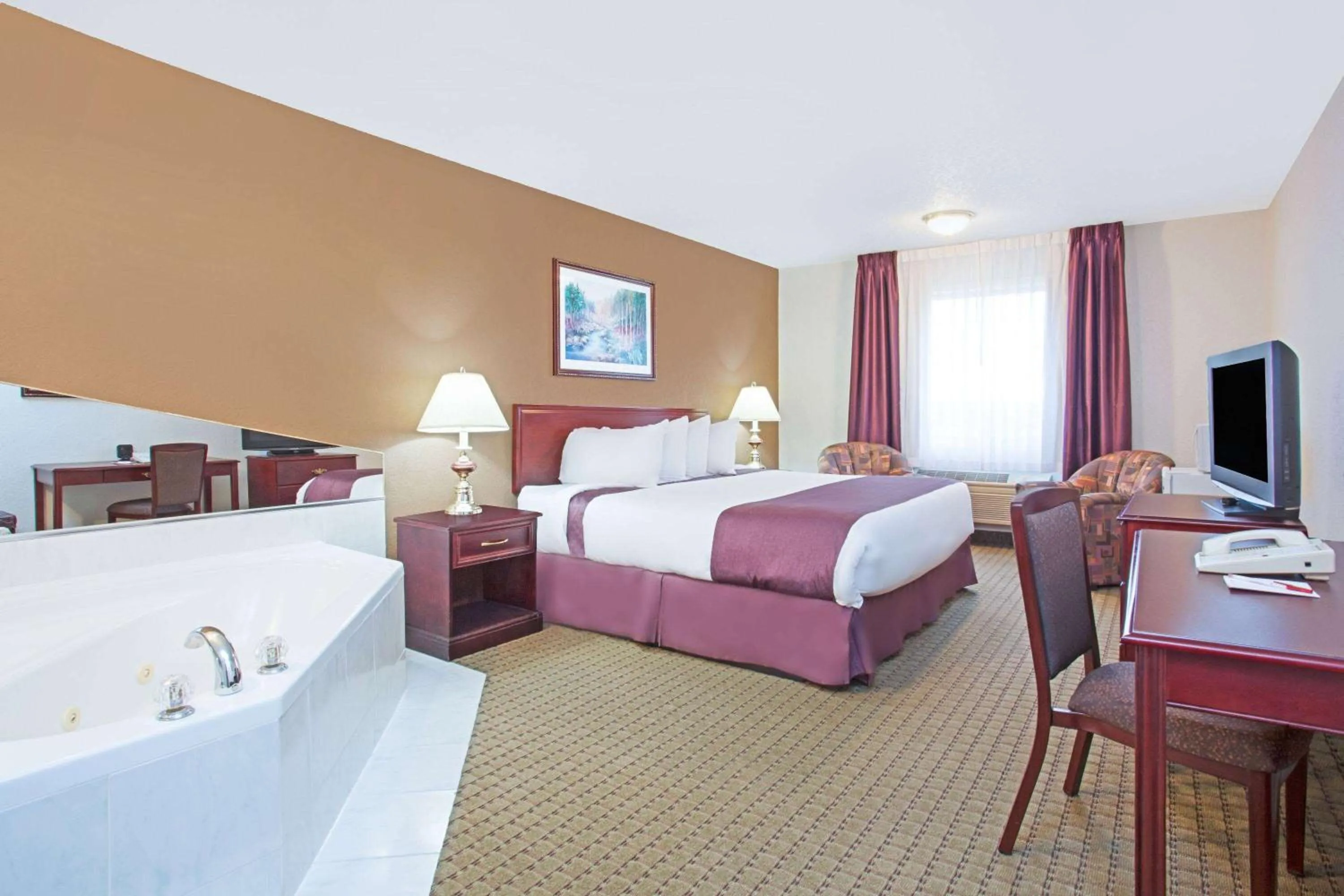 Photo of the whole room, Bed in Ramada by Wyndham Red Deer Hotel & Suites