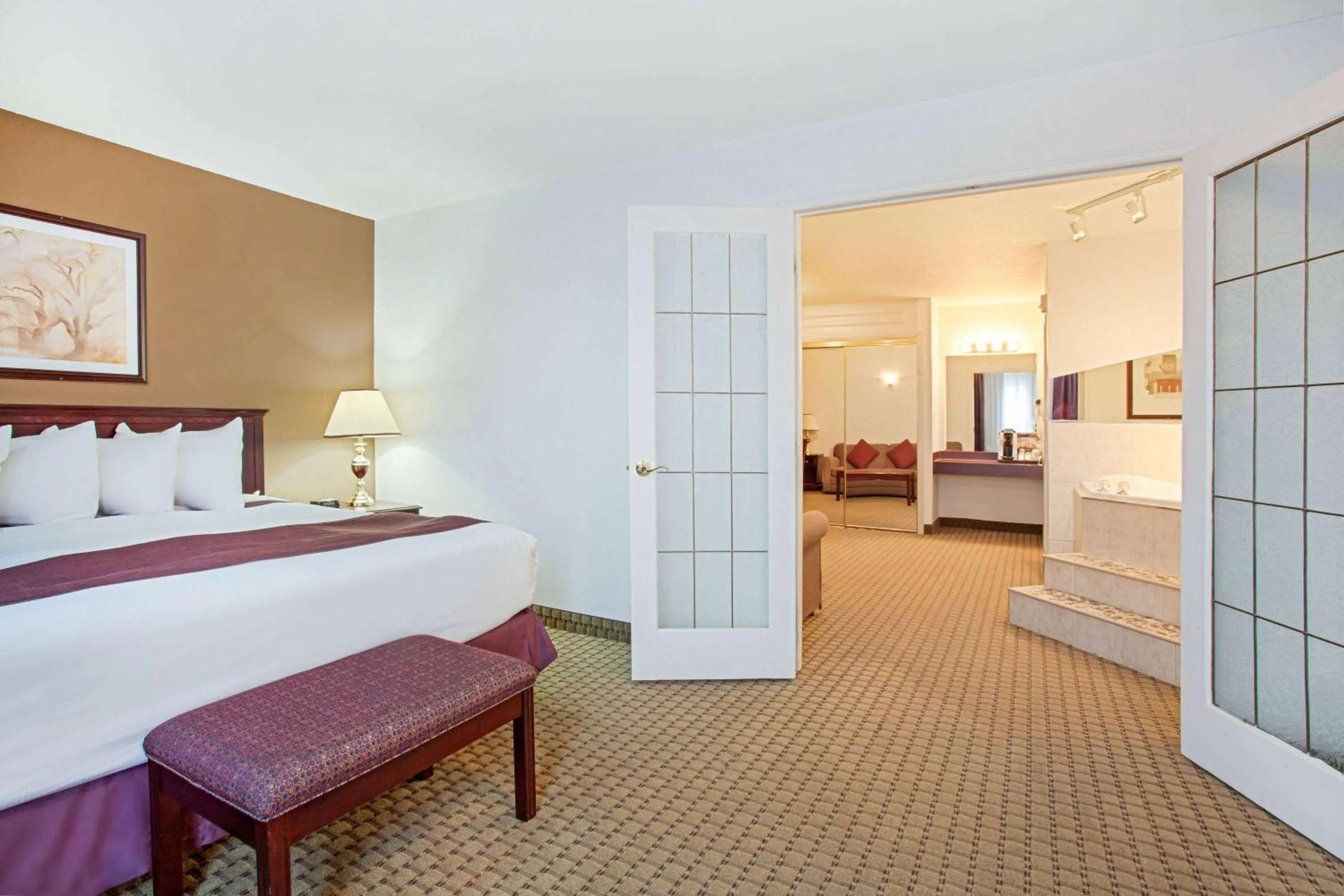 Bed in Ramada by Wyndham Red Deer Hotel & Suites