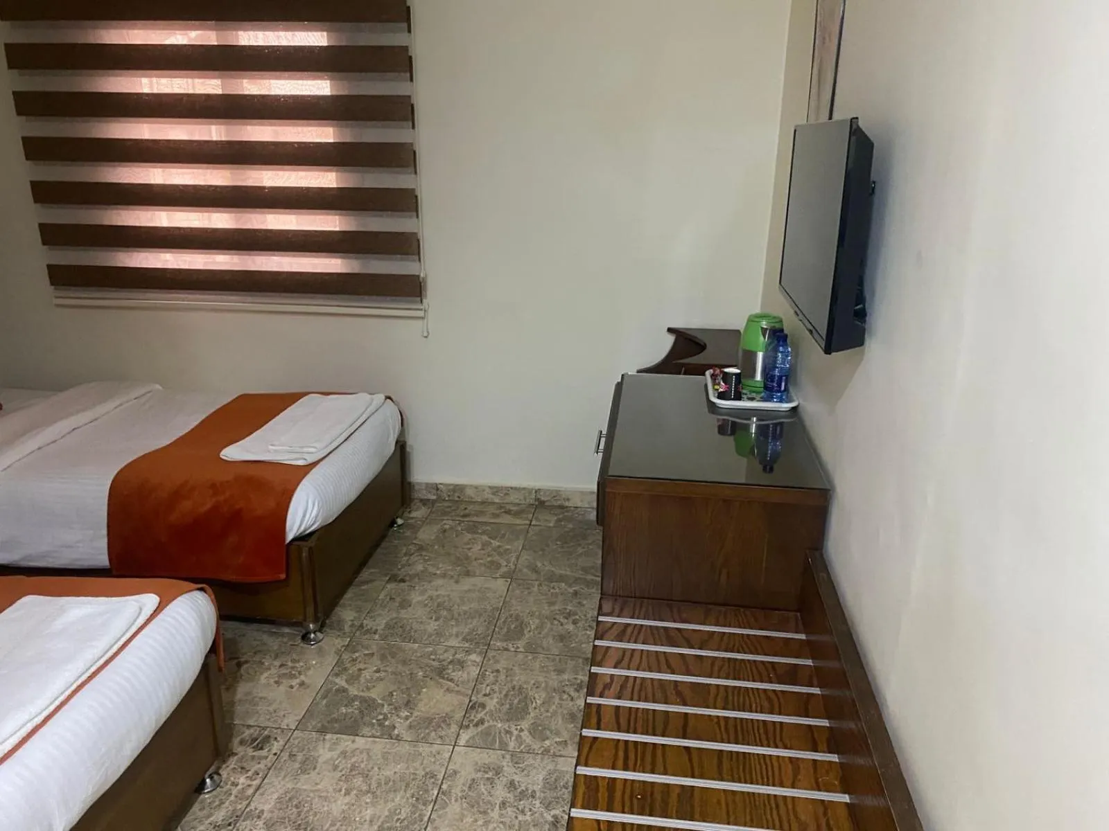 Communal lounge/ TV room, Bed in Sunset Hotel