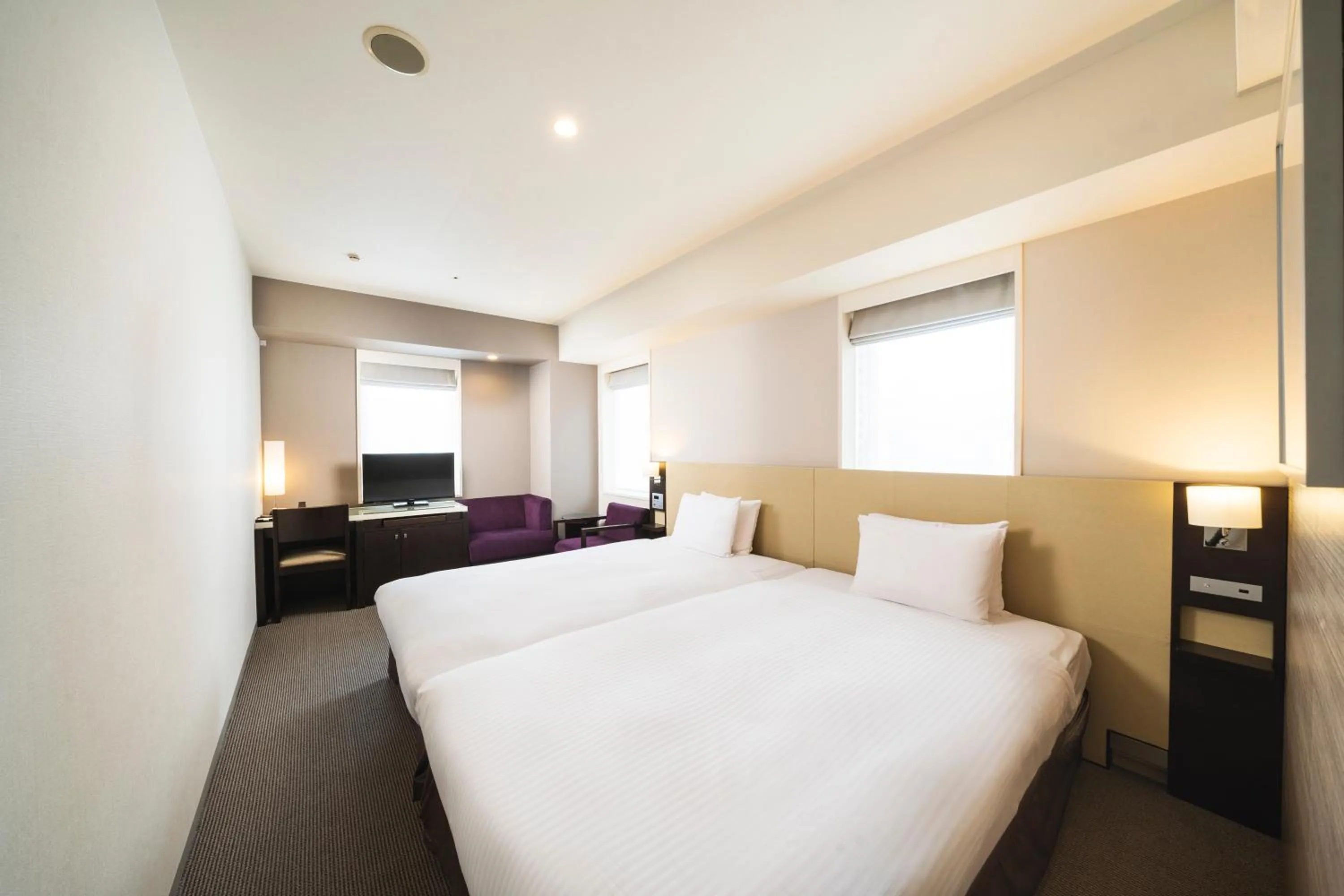 Bed in KOKO HOTEL Kobe Sannomiya