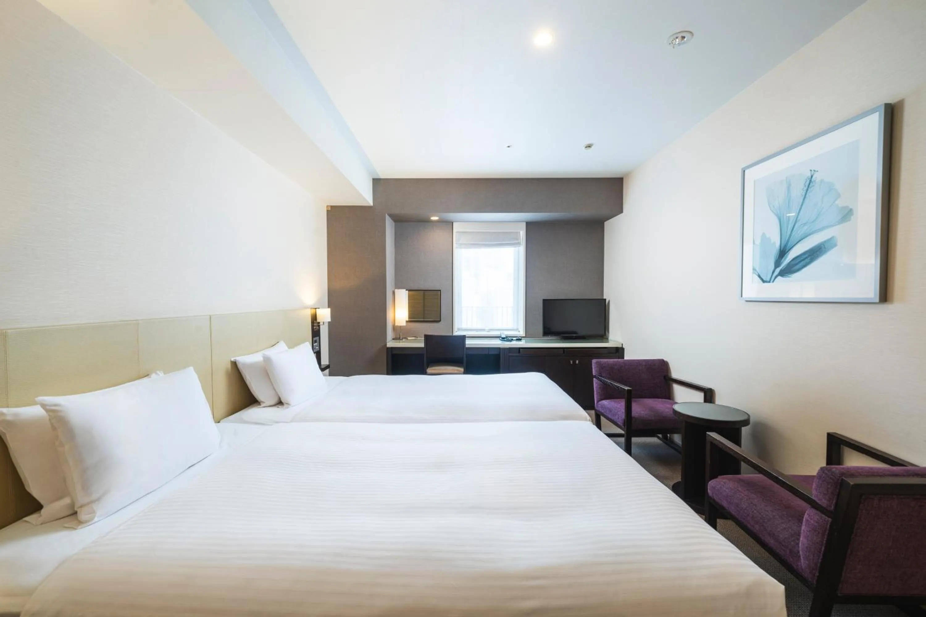 Bed in KOKO HOTEL Kobe Sannomiya