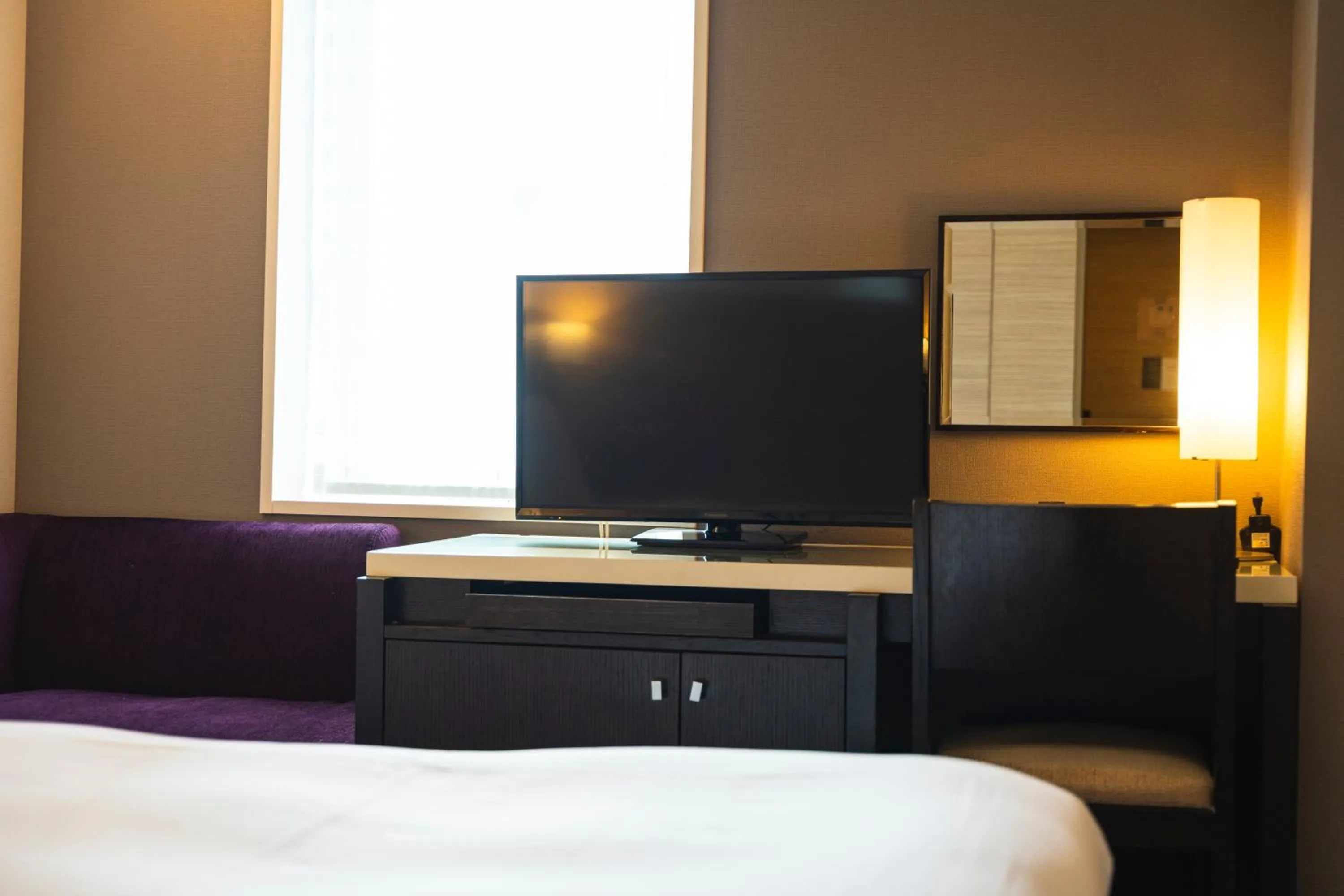 Bed in KOKO HOTEL Kobe Sannomiya