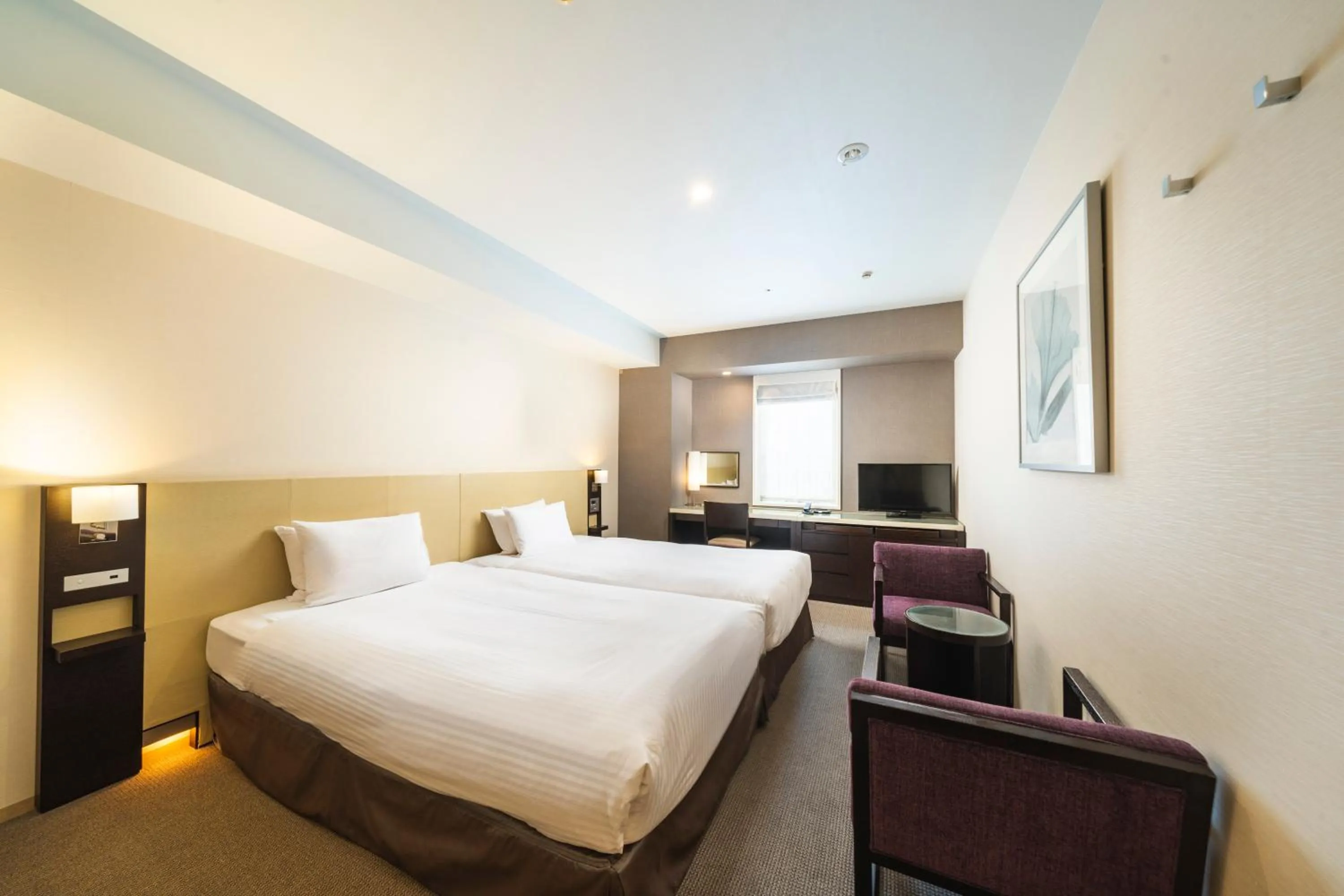 Bed in KOKO HOTEL Kobe Sannomiya