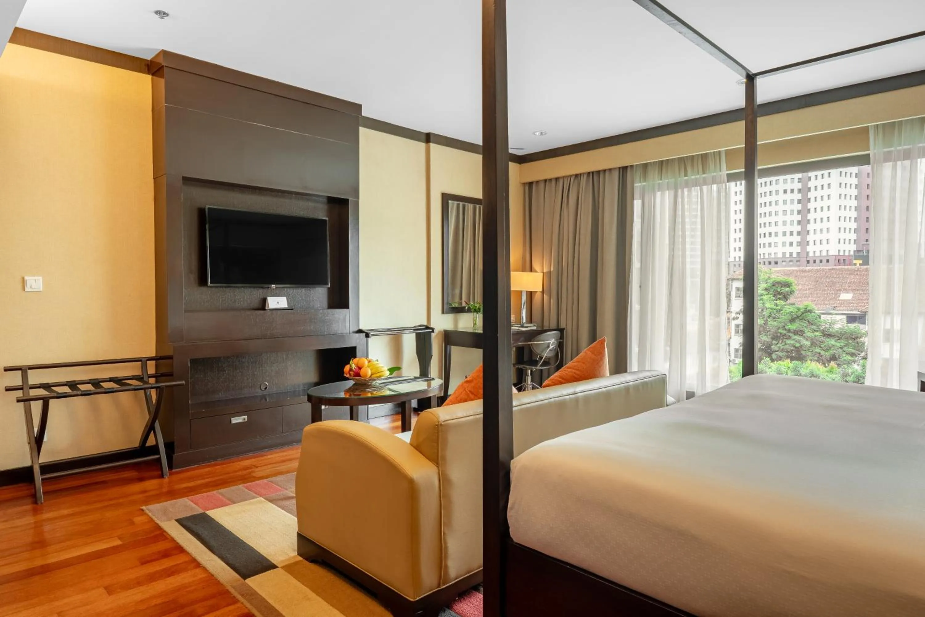 Seating area, Bed in Micasa All Suites Hotel