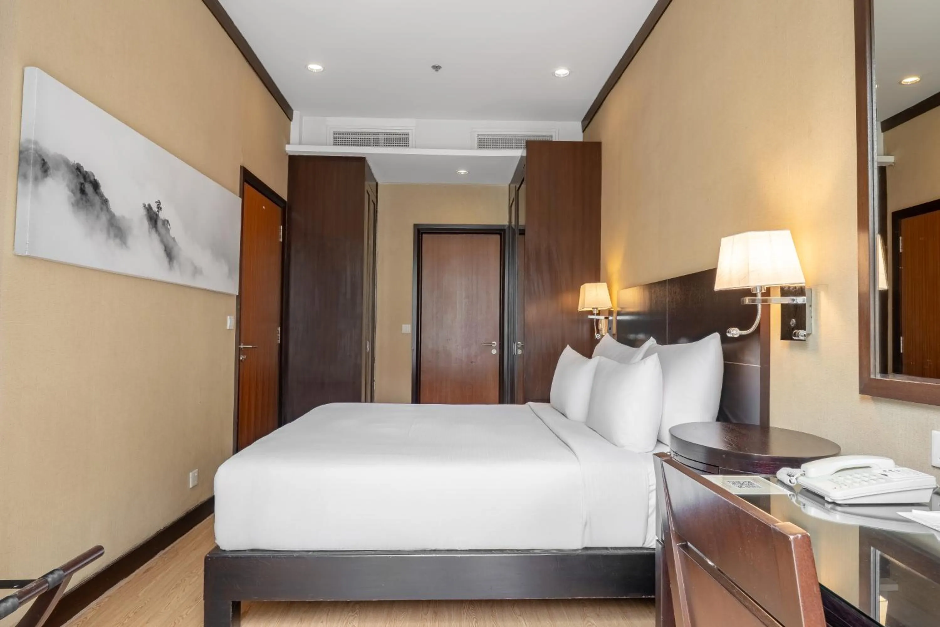 Bed in Micasa All Suites Hotel