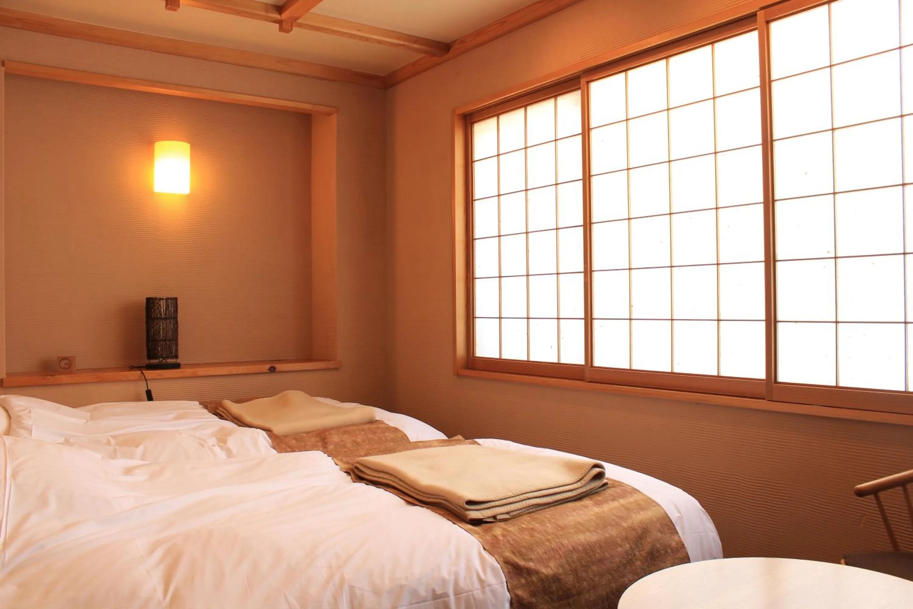 Bed in Miyama Ouan Kyoritsu Resort