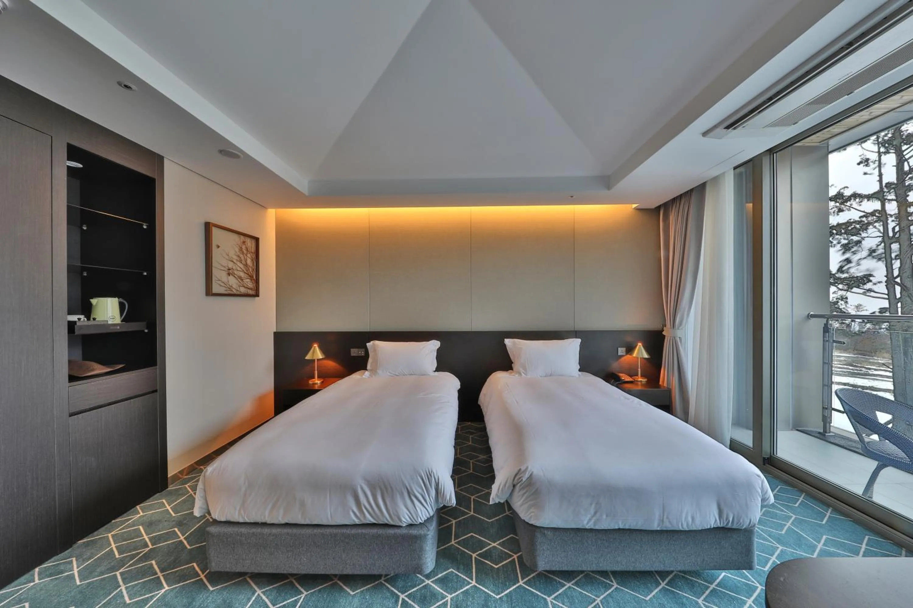 Bed in Camphortree Hotel and Resort