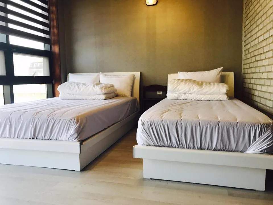 Bed in White Windmill Guesthouse