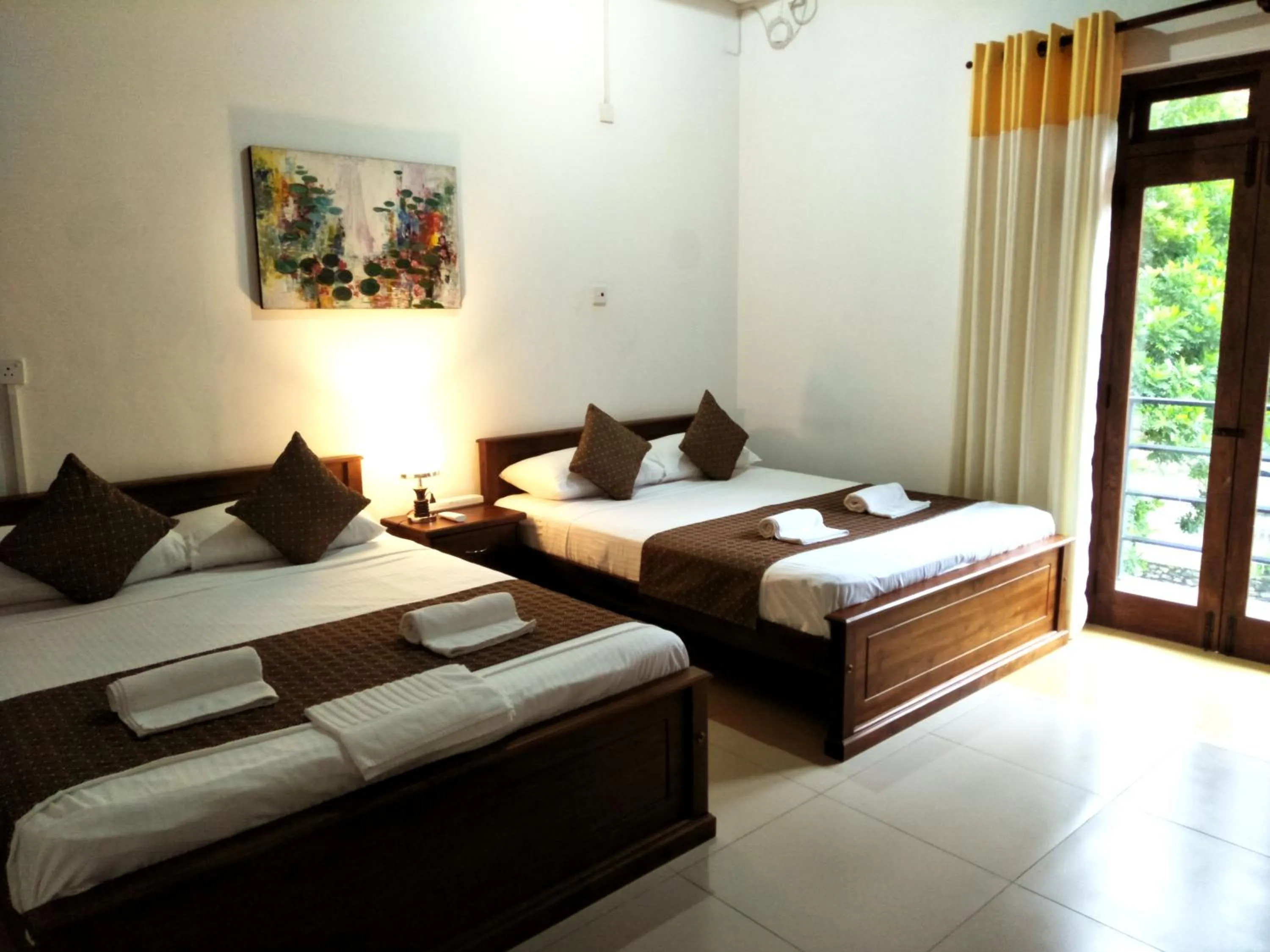 Bed in Sarvodaya Samma Vaasa Residence