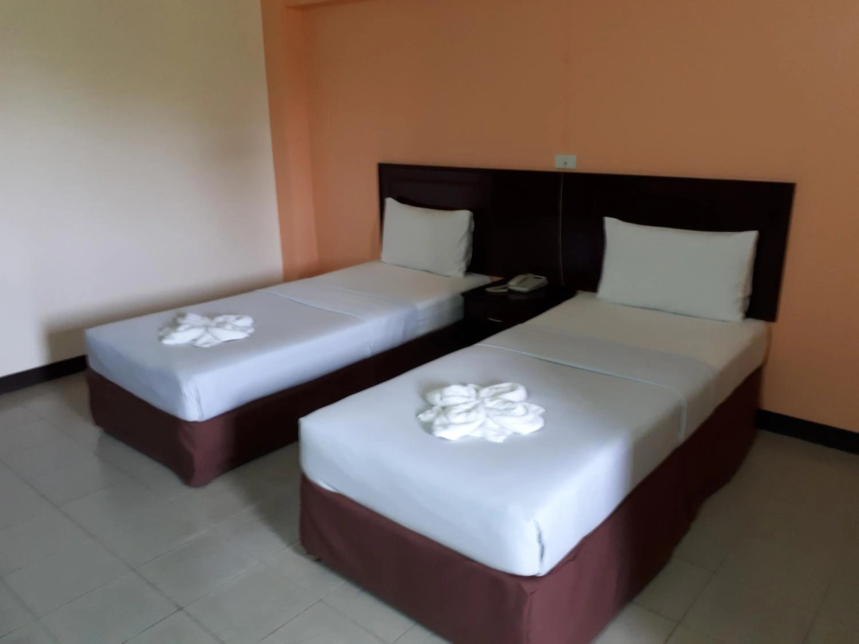 Bed in Centerpoint Hotel