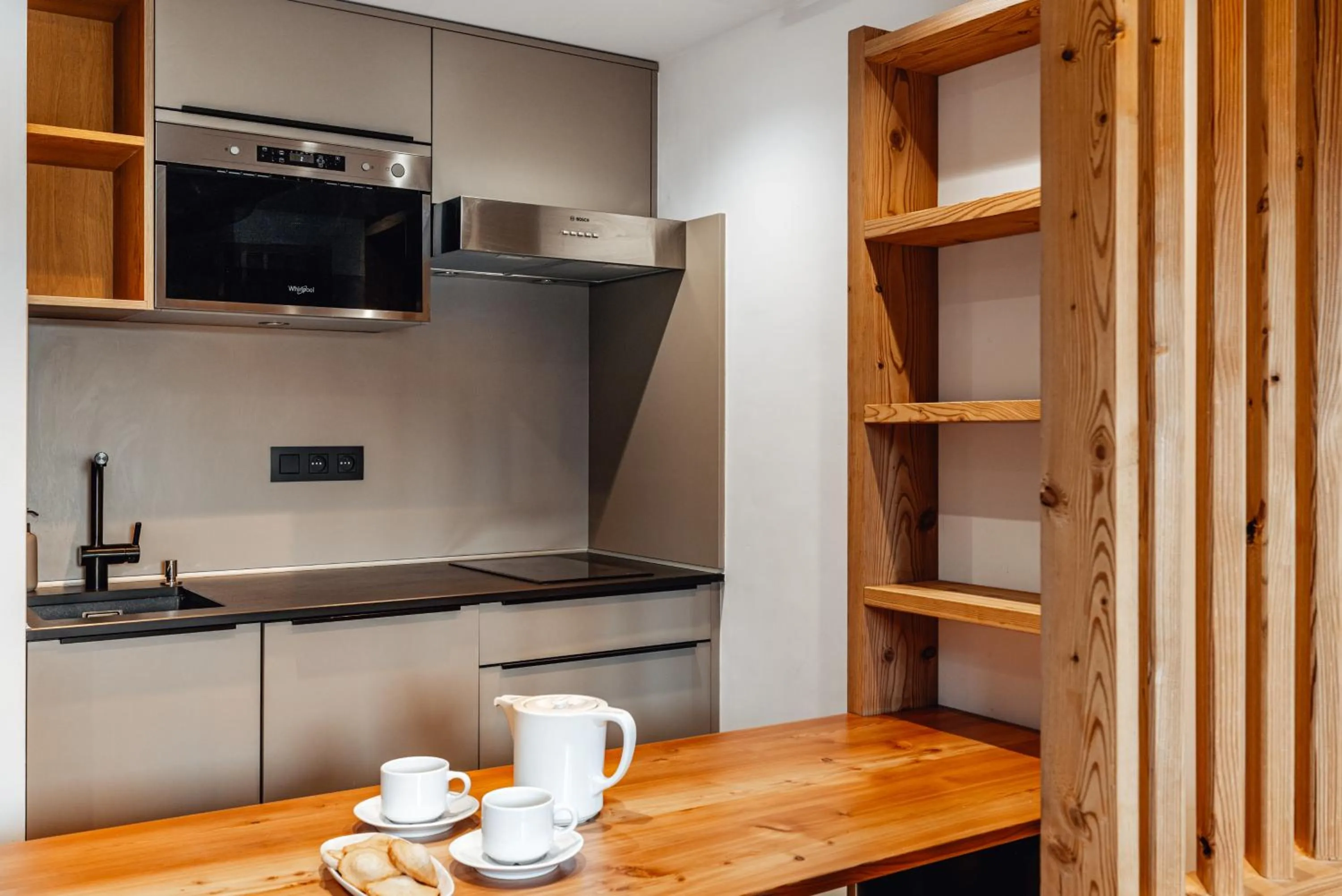 Kitchen or kitchenette in Alliey & Spa Piscine Appart-hôtel Serre chevalier