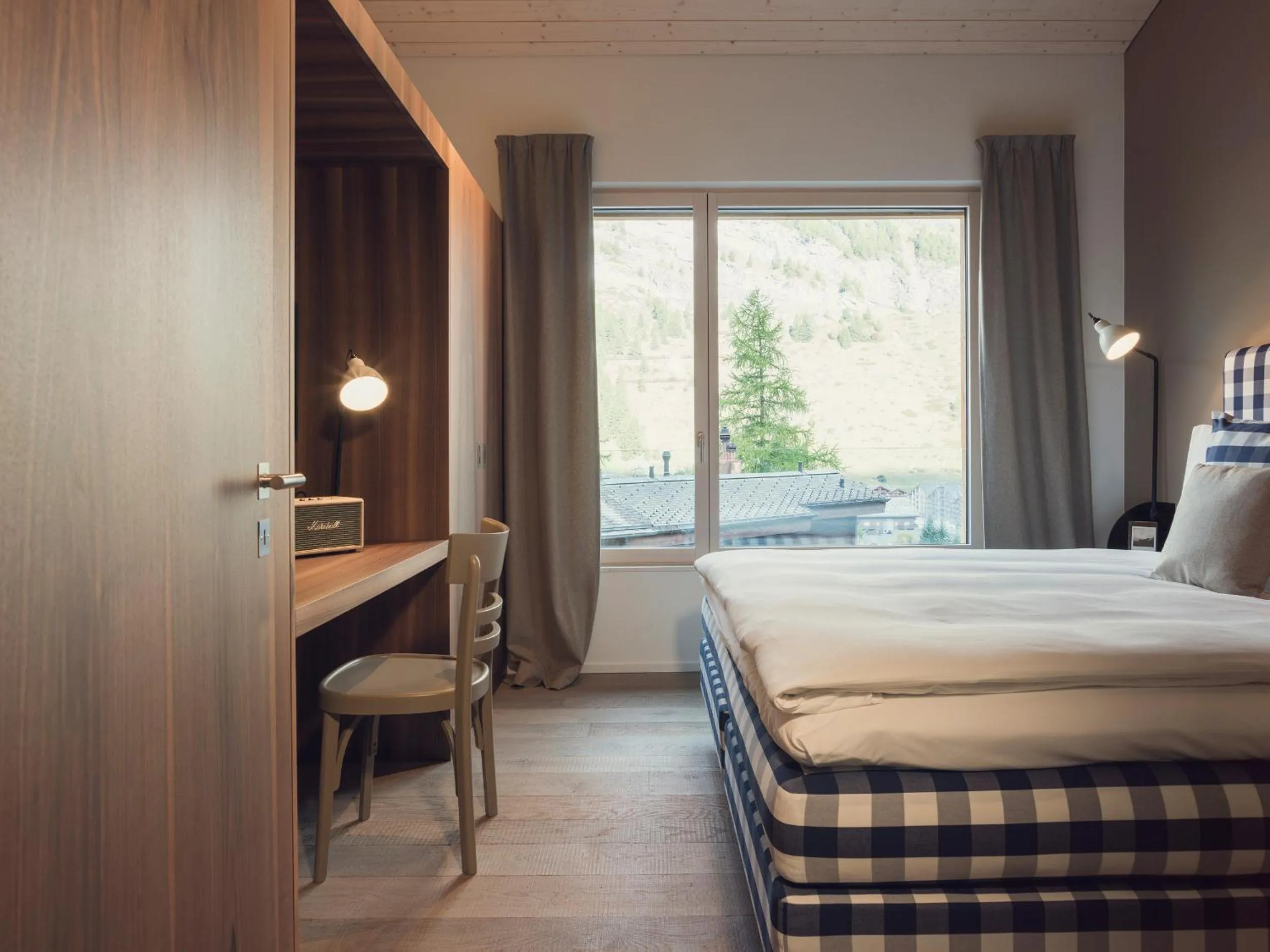Bed in OVERLOOK Lodge by CERVO Zermatt