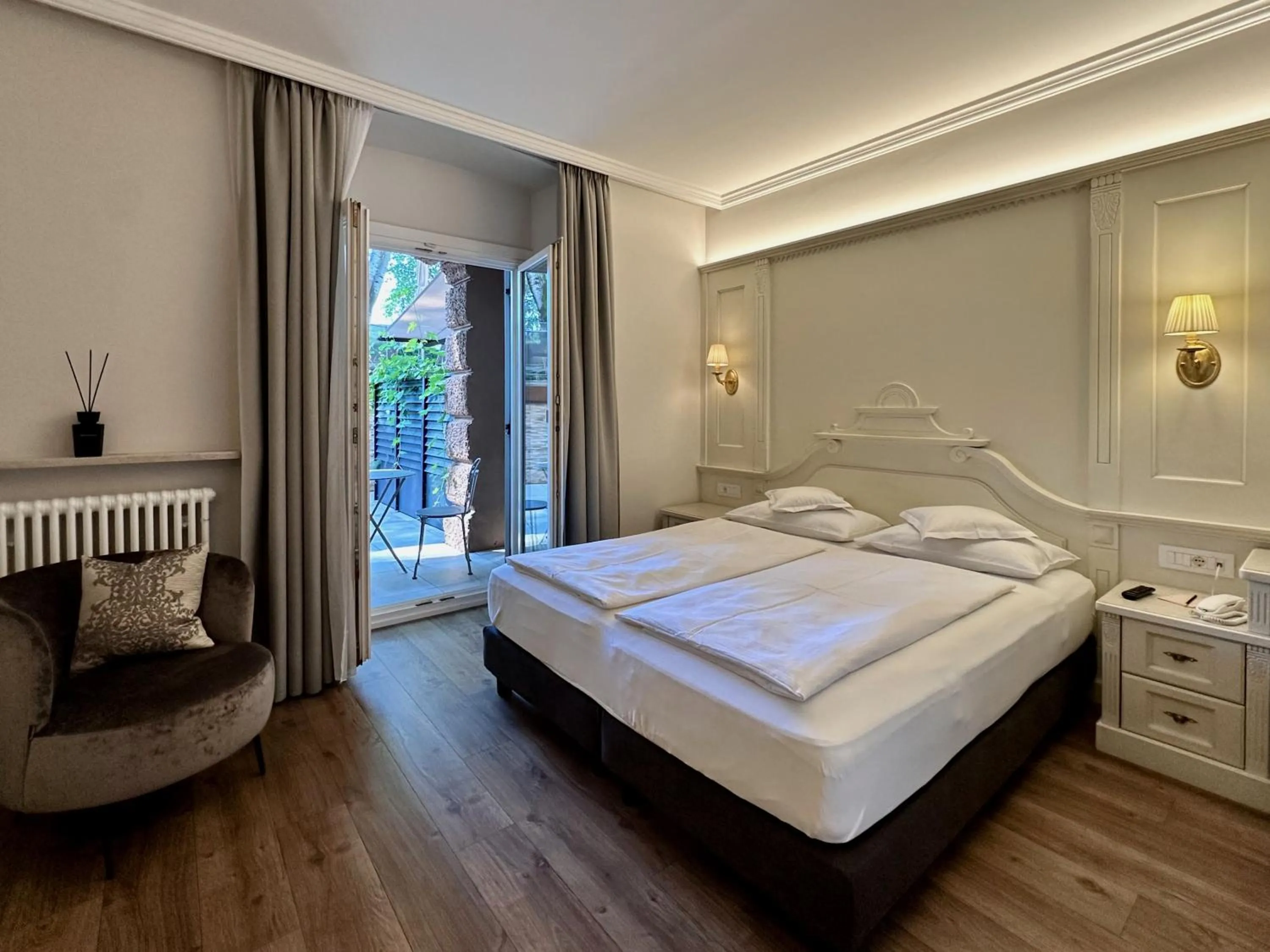 Bed in Windsor Merano Hotel & Suites