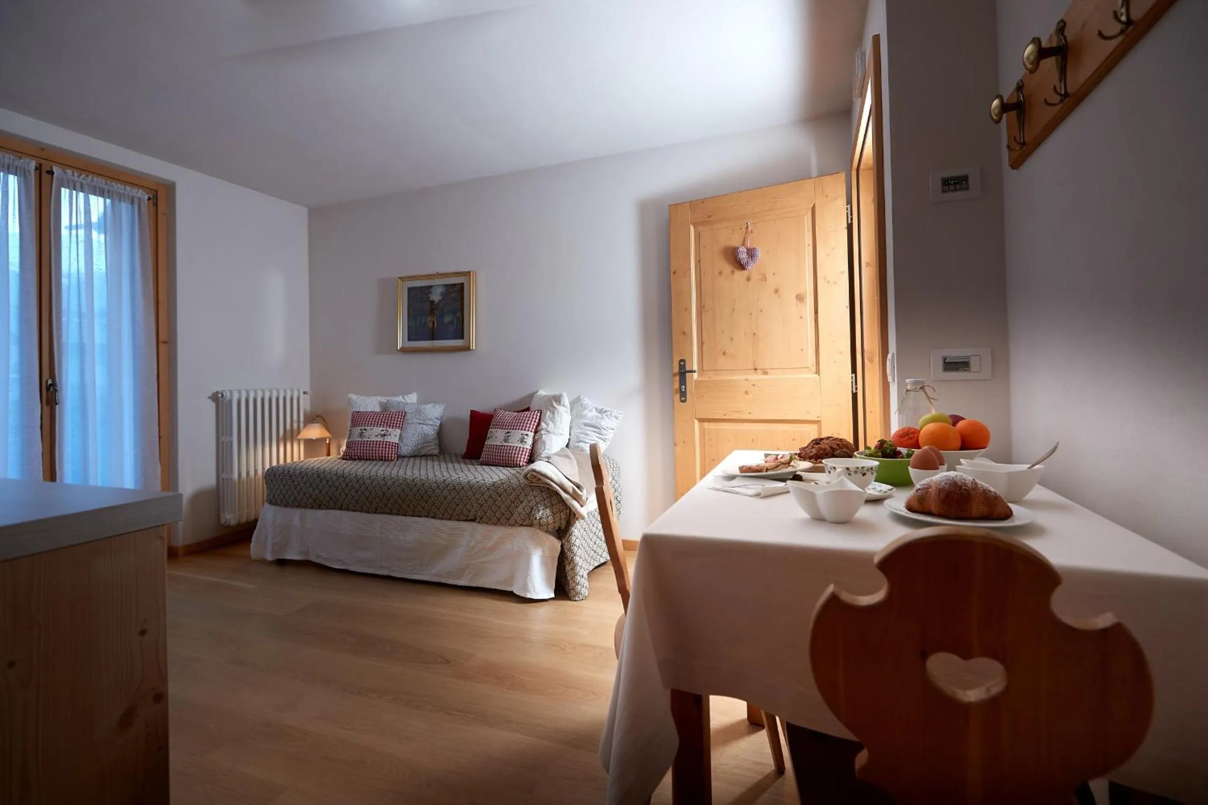 Seating area, Bed in Meublè Cima Bianca Garni