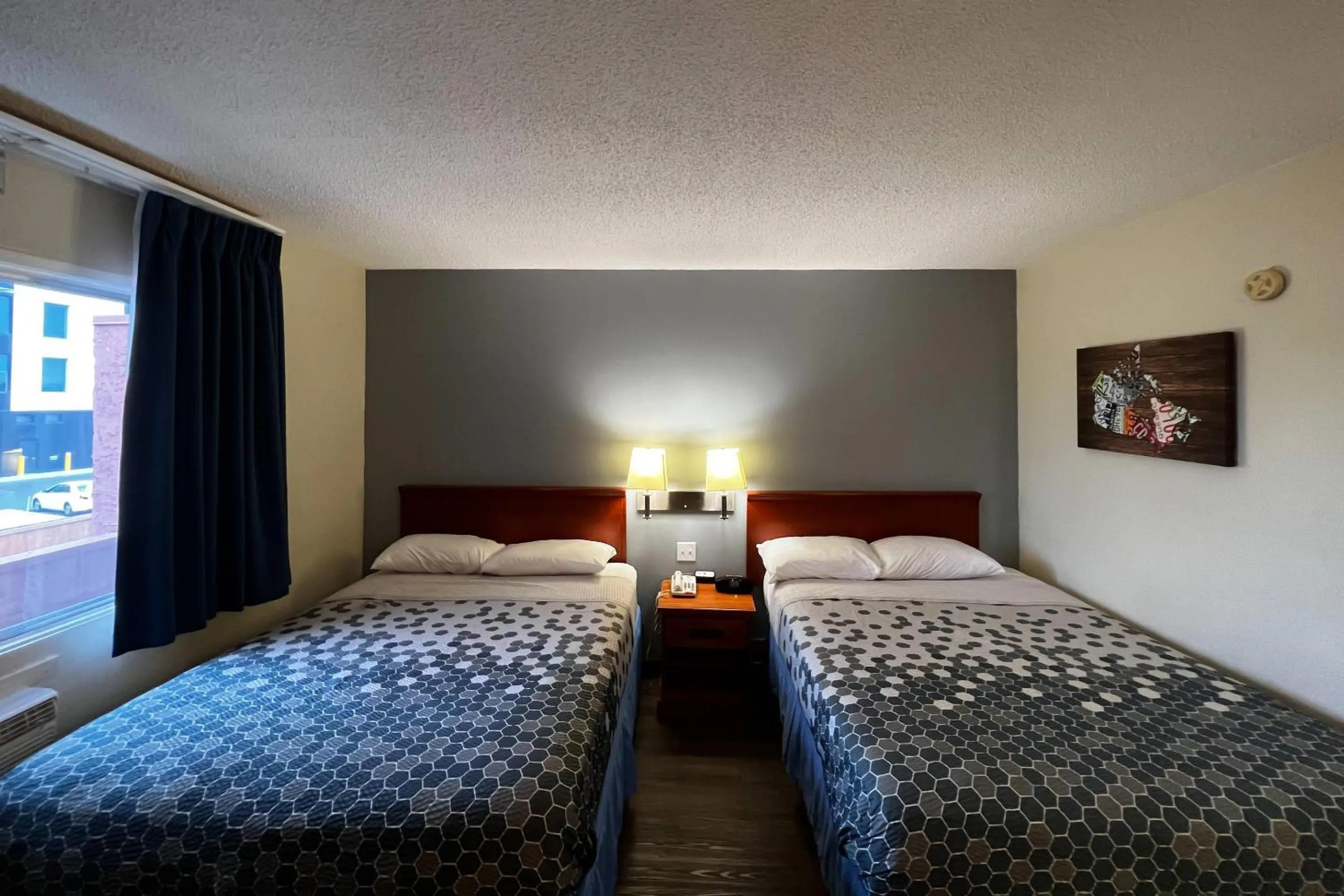 Bedroom, Bed in Econo Lodge Motel Village