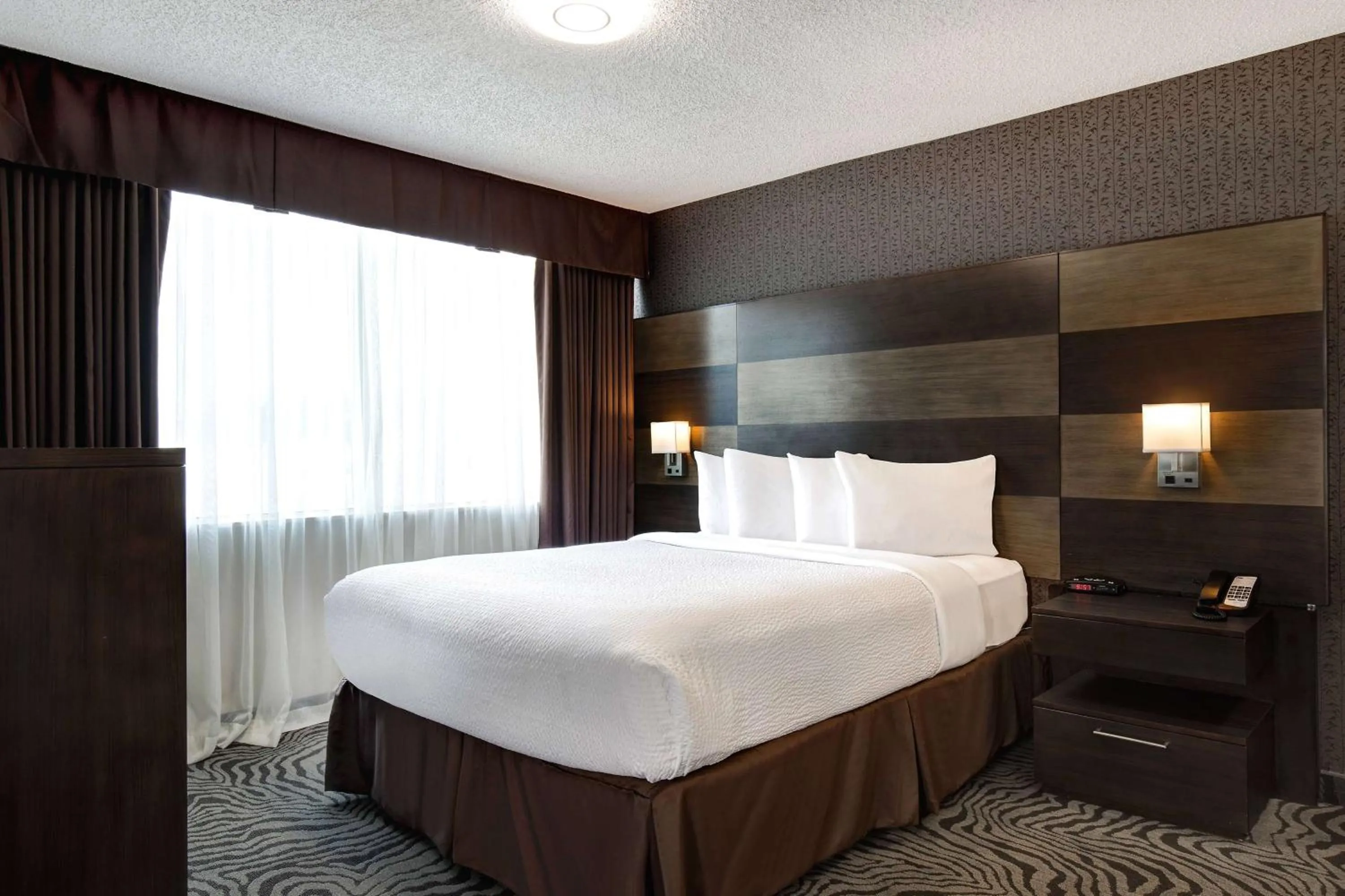Photo of the whole room, Bed in Days Inn by Wyndham Calgary South