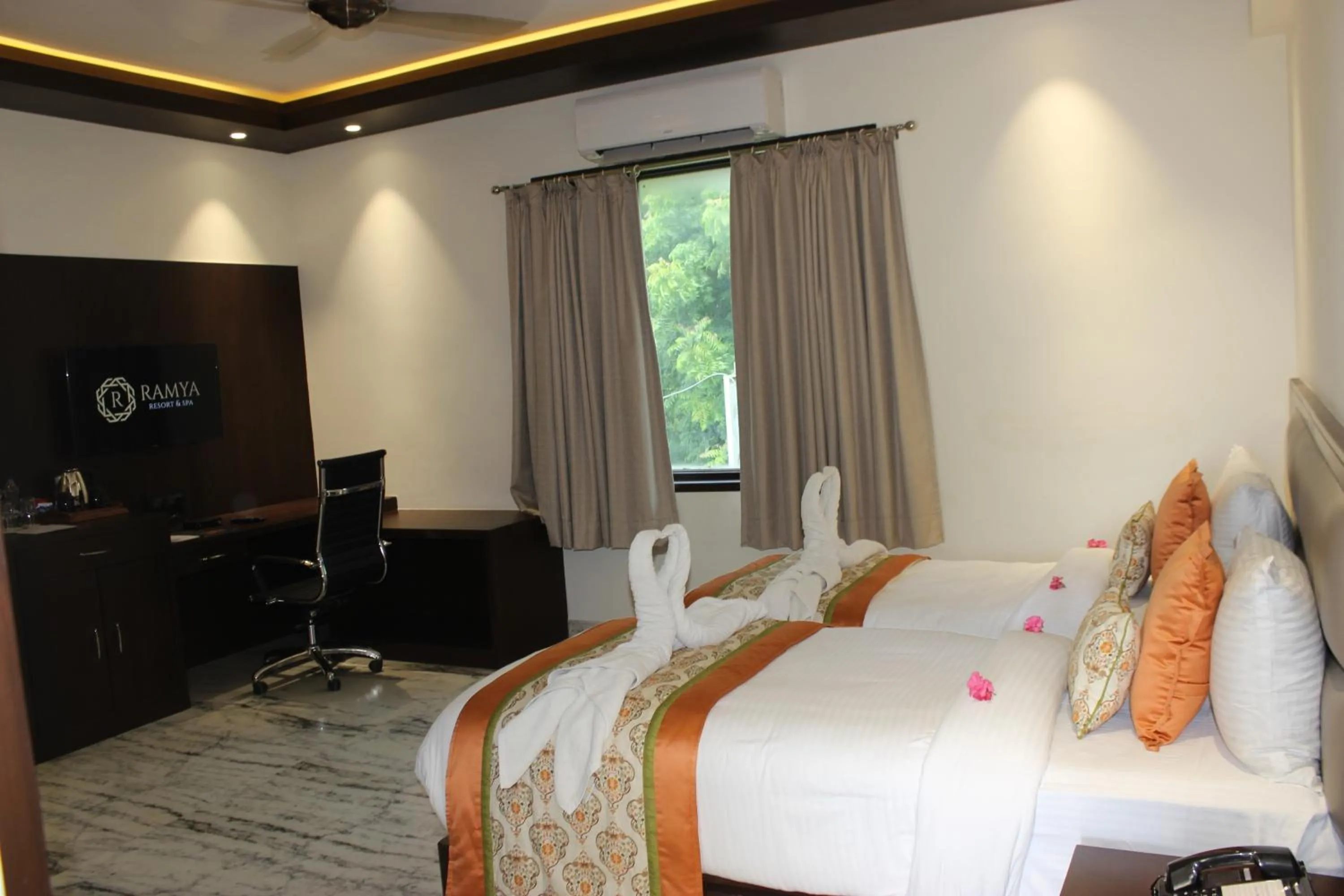Bed in Ramya Resort & Spa