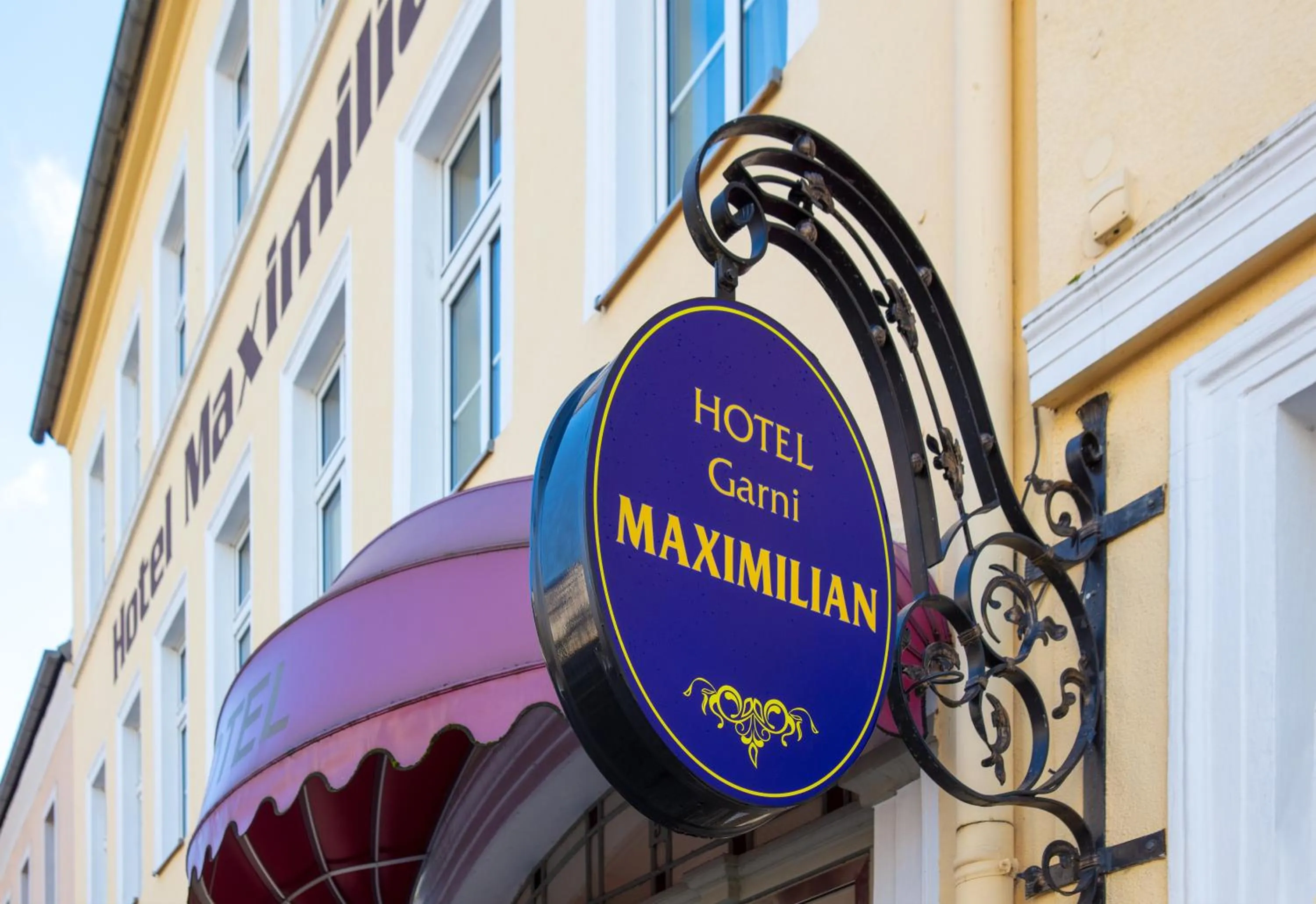 Property logo or sign in Hotel Maximilian