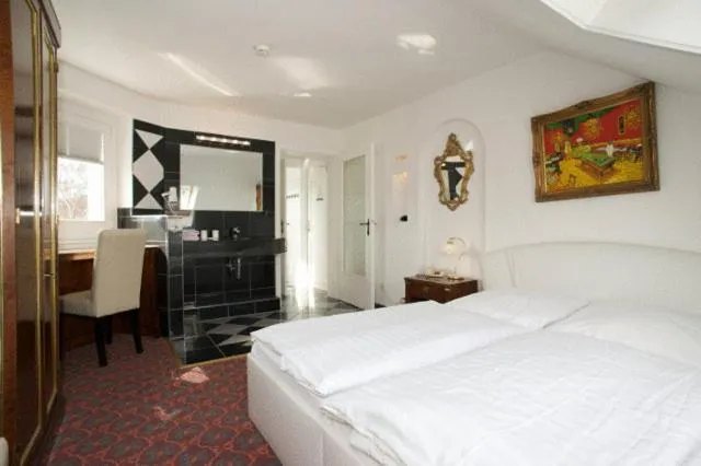 Bed in Hotel Behrmann