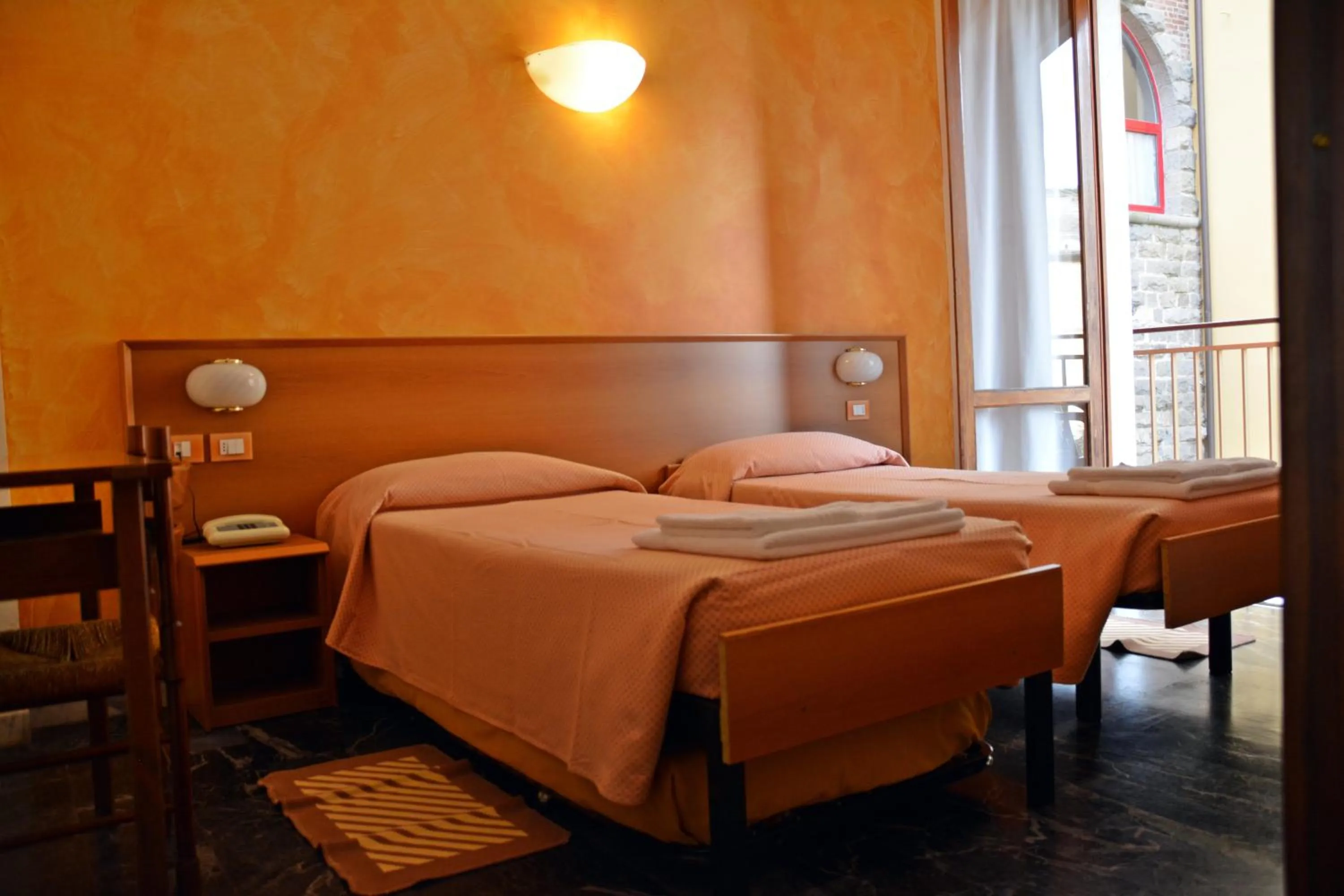 Bed in Hotel Corallo