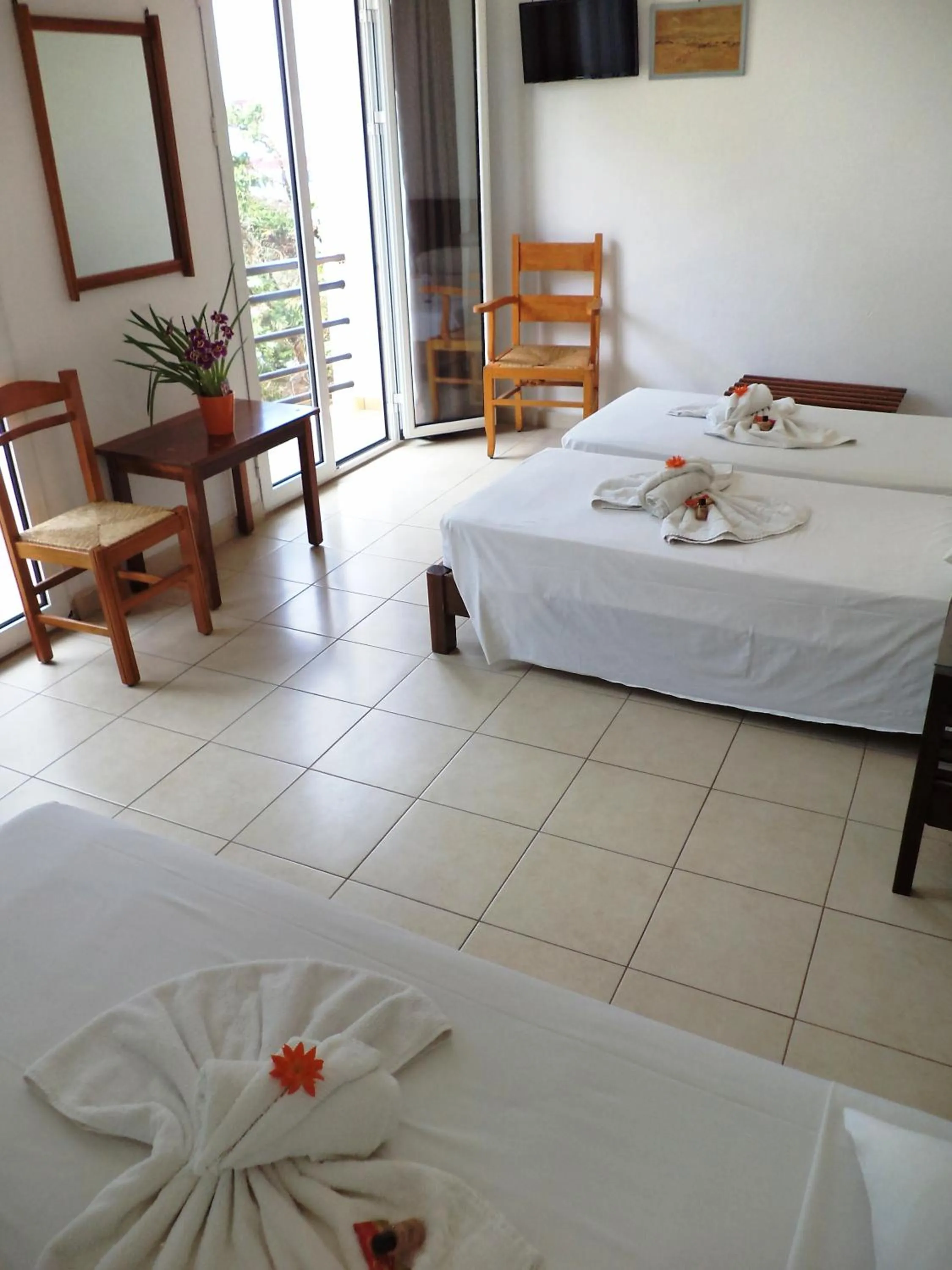 Bed in Poseidon Hotel