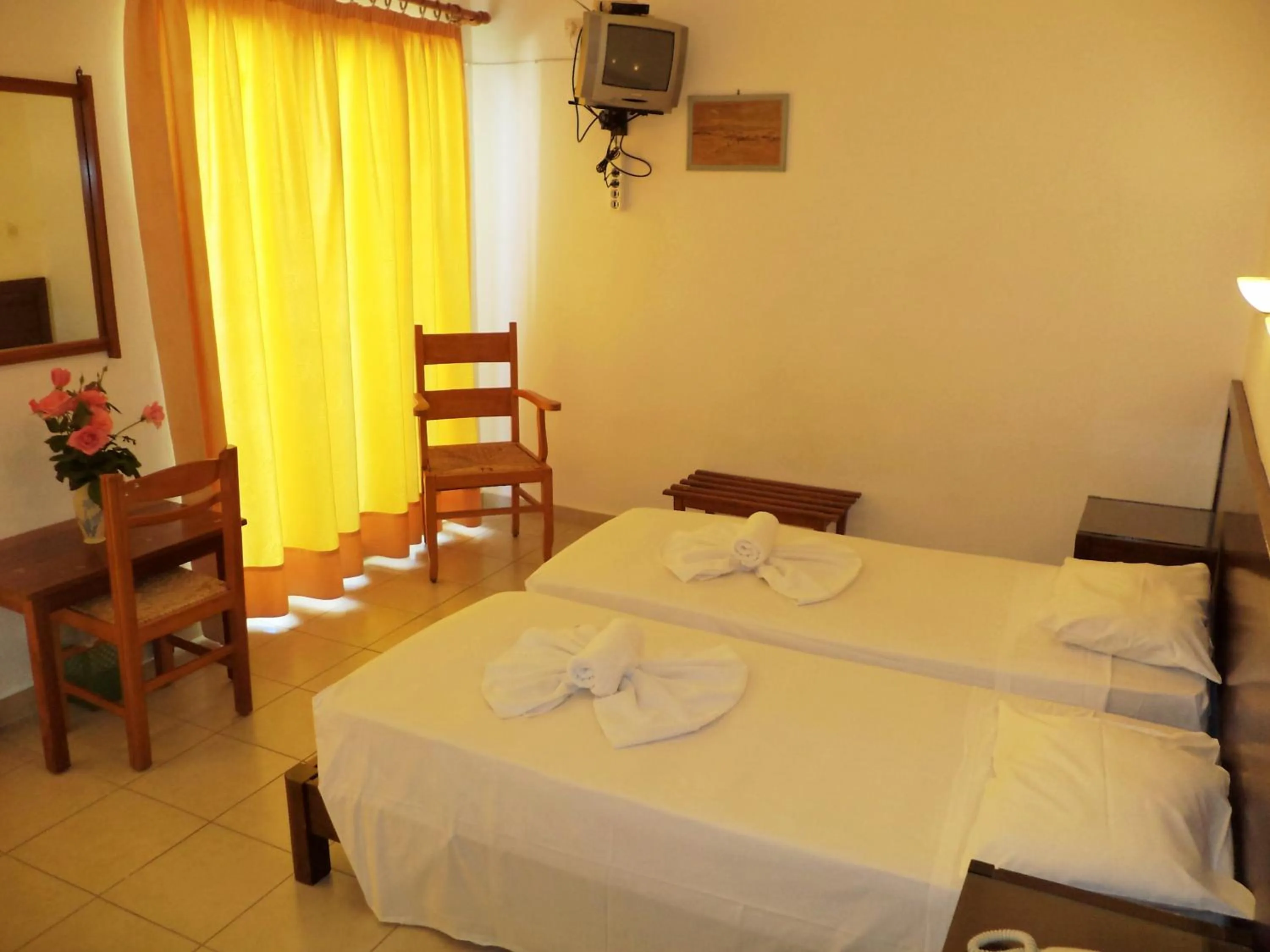 Bed in Poseidon Hotel