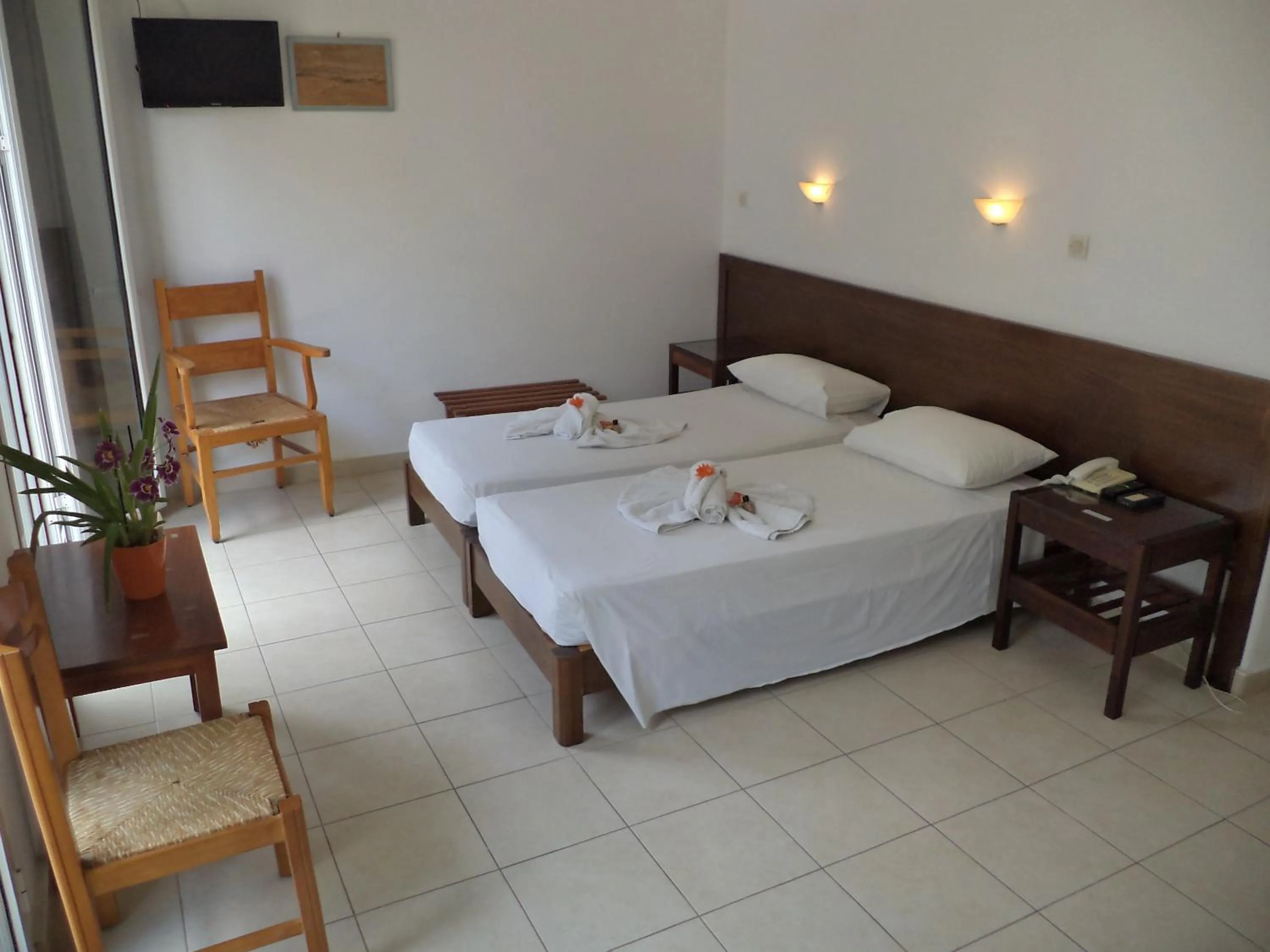 Bed in Poseidon Hotel