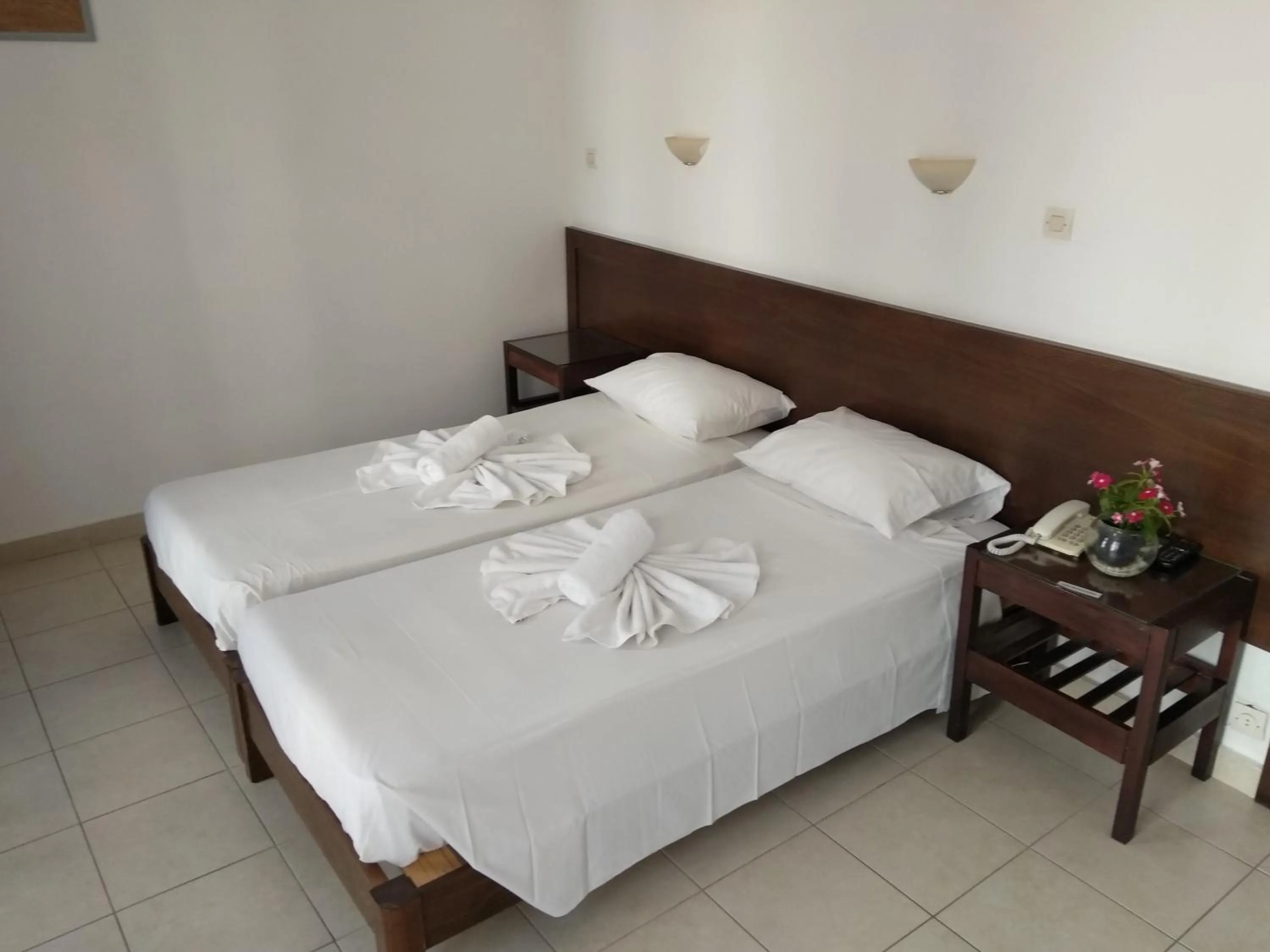 Bed in Poseidon Hotel