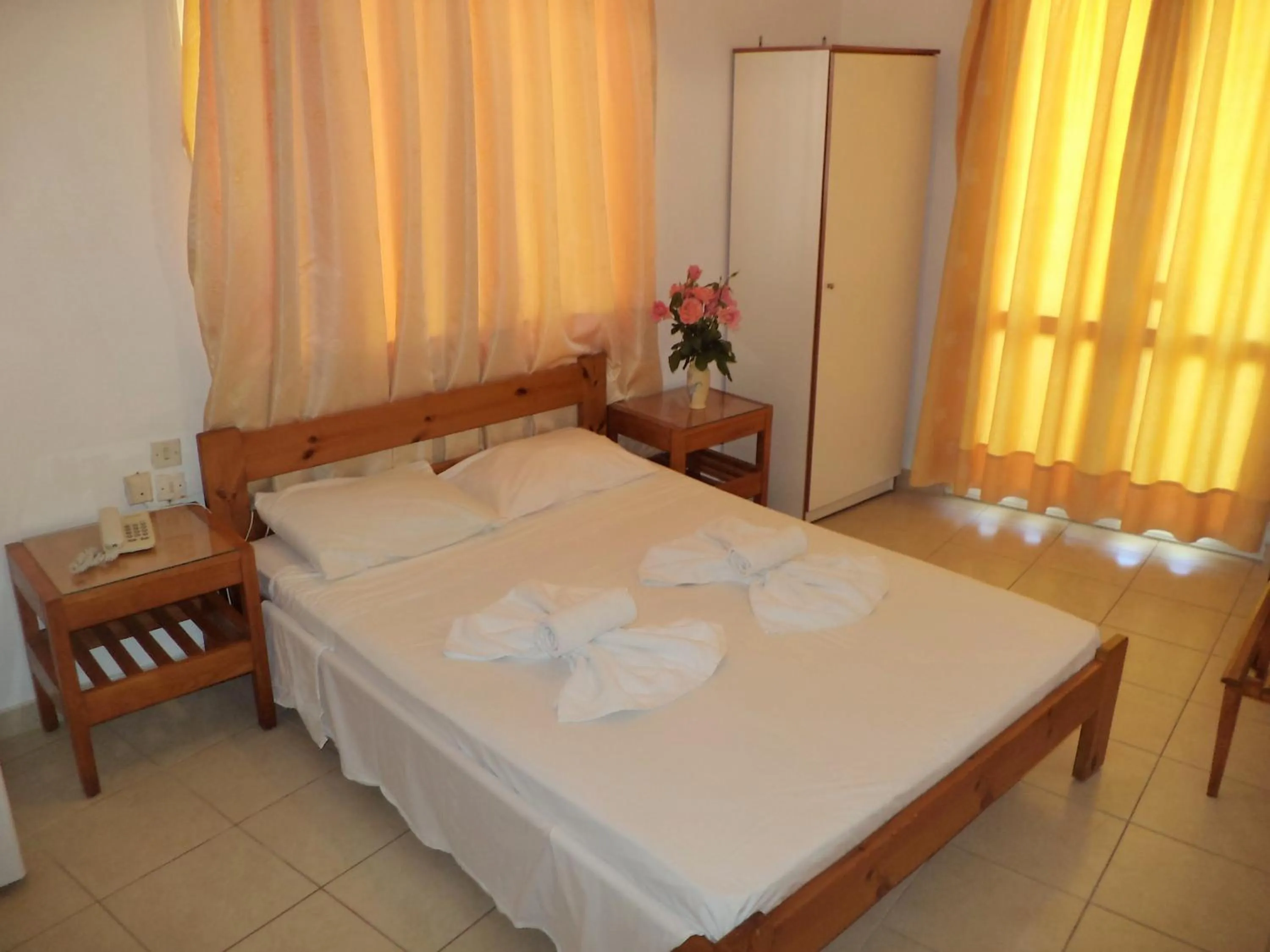 Bed in Poseidon Hotel