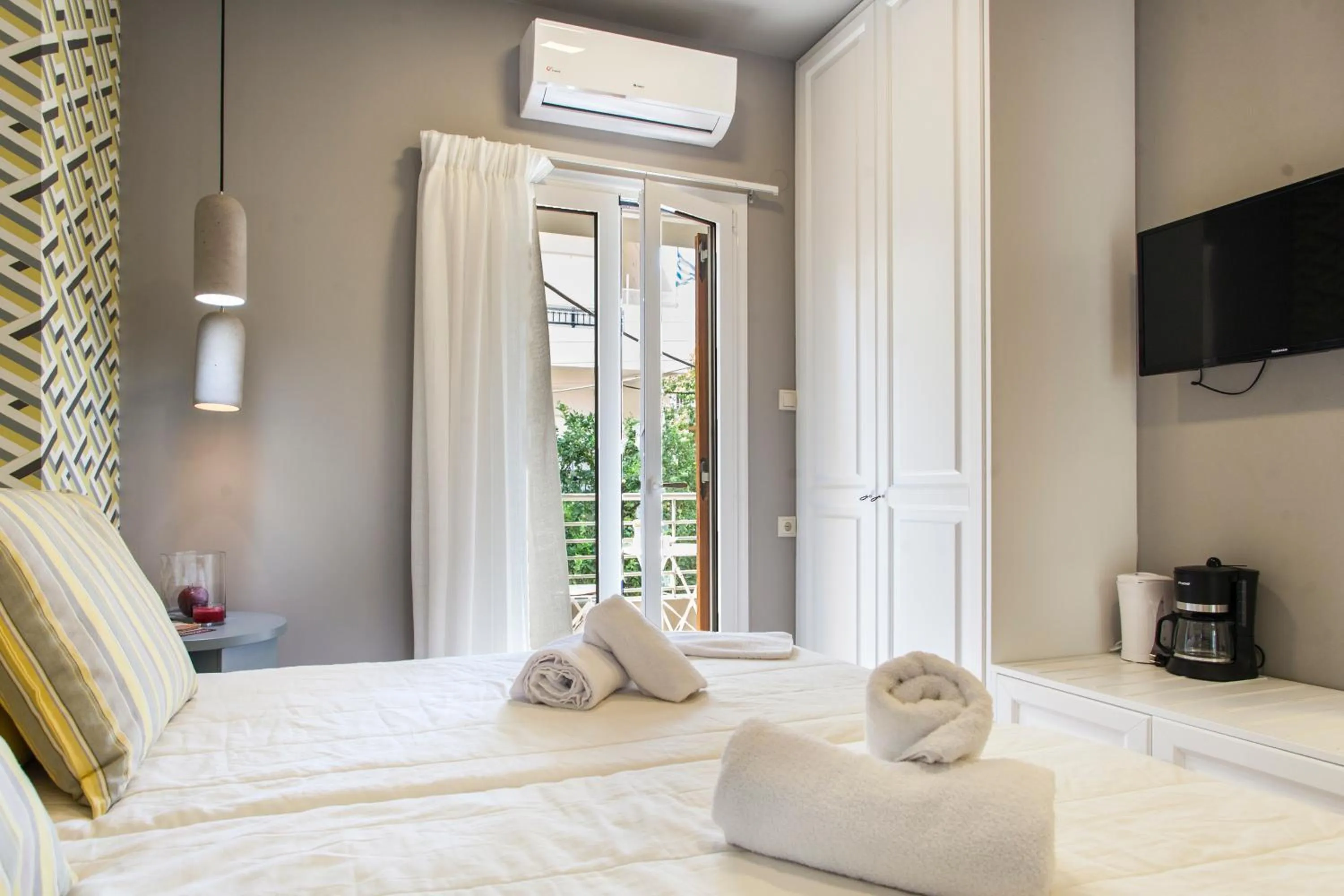 Bed in Candia Studios & Rooms