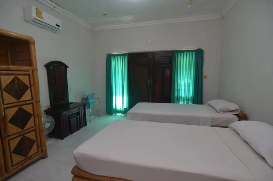 Bed in Puri Itoma Bungalows