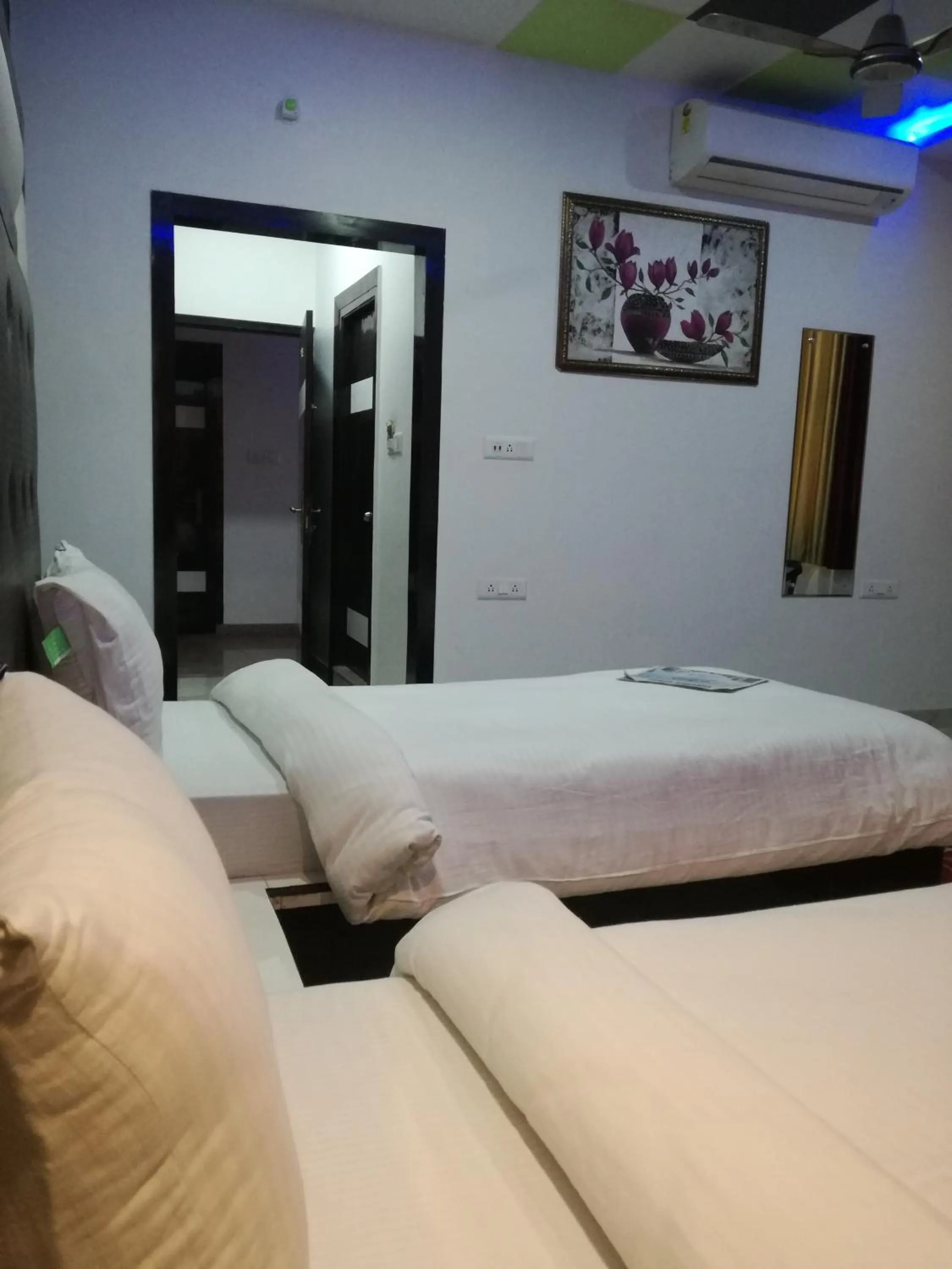 Bed in Hotel Dhanraj Palace