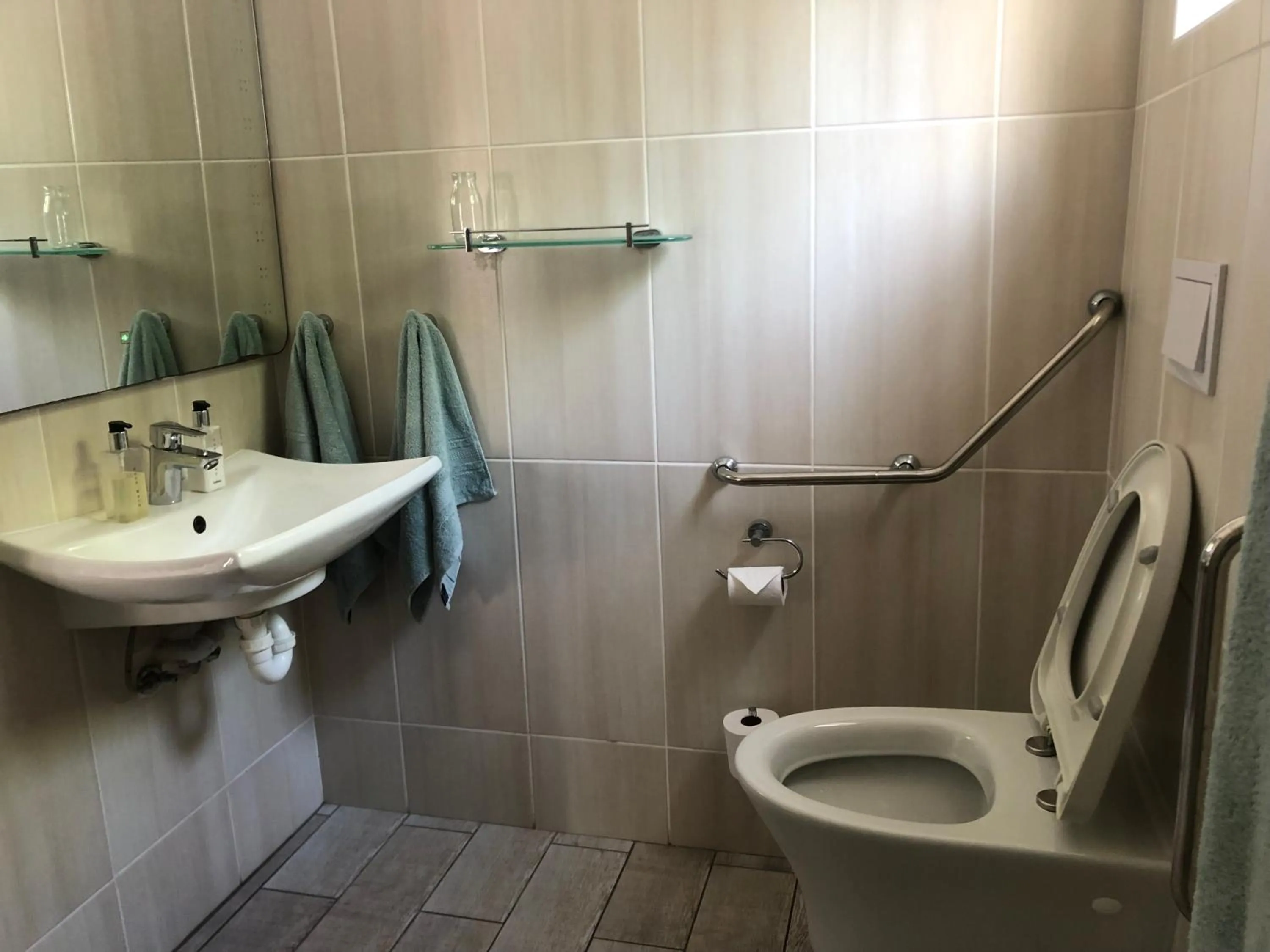 Toilet in BlueSky Arniston Guest House