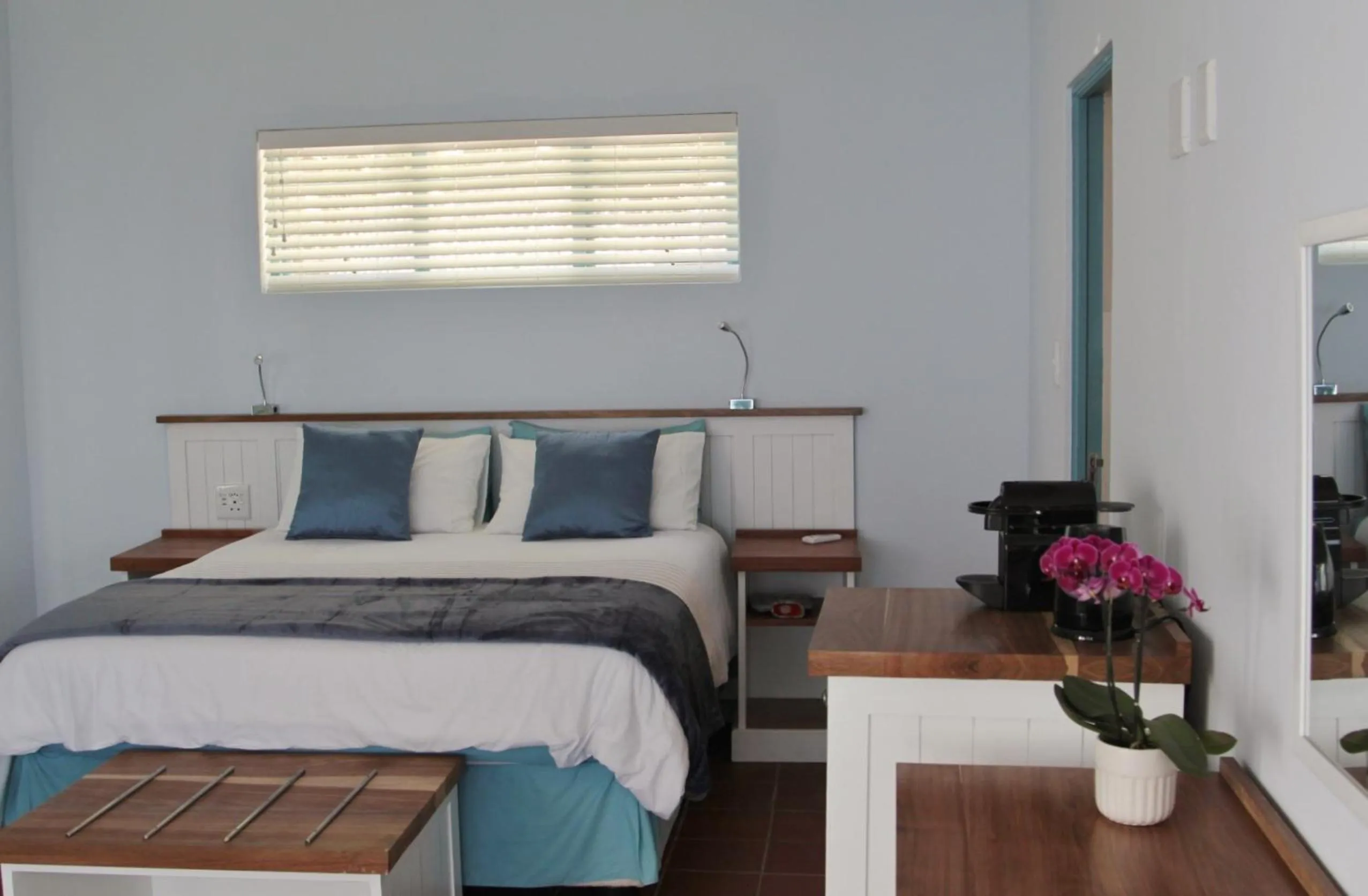 Bed in BlueSky Arniston Guest House