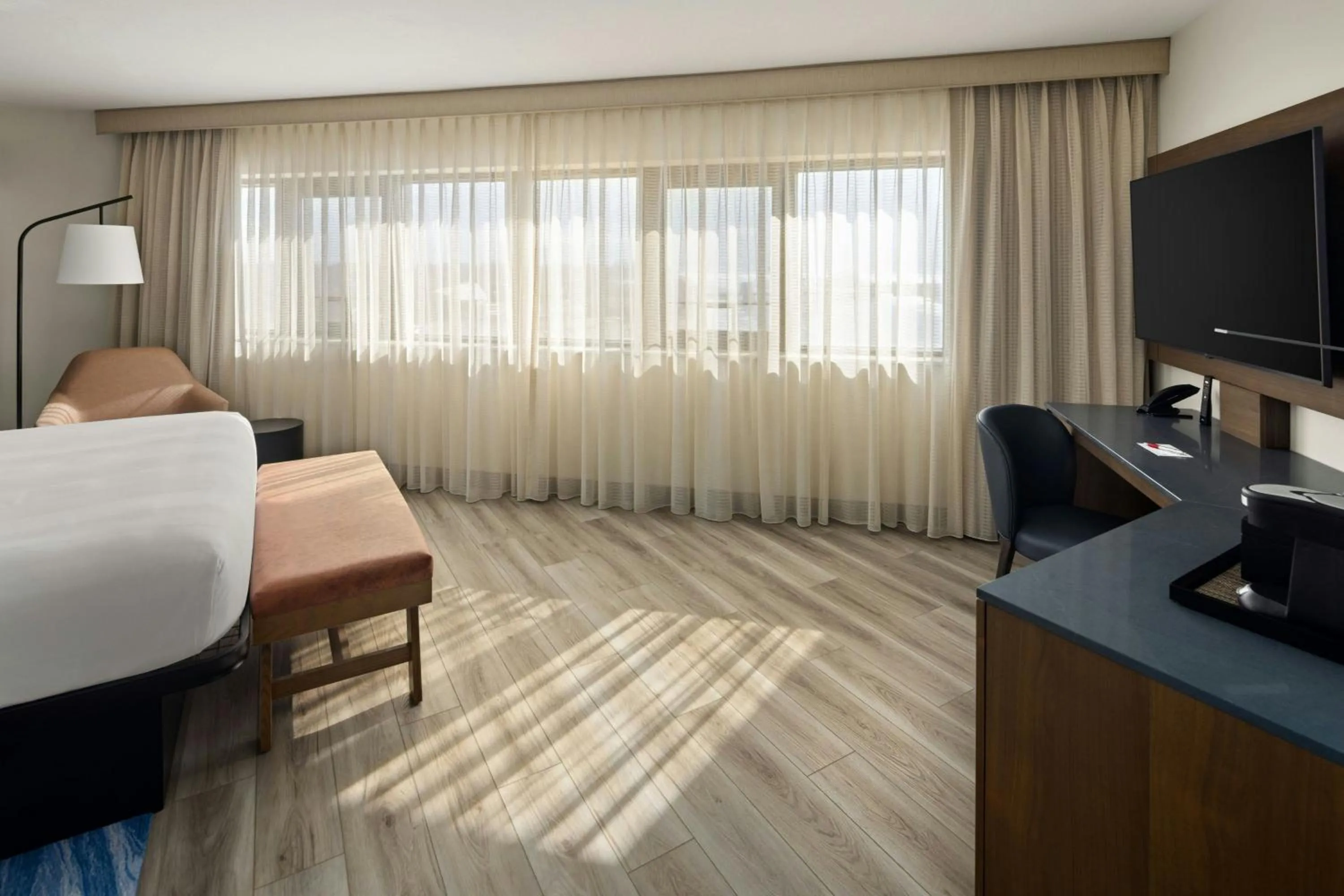 Photo of the whole room, Bed in Oshkosh Marriott Waterfront Hotel & Convention Center