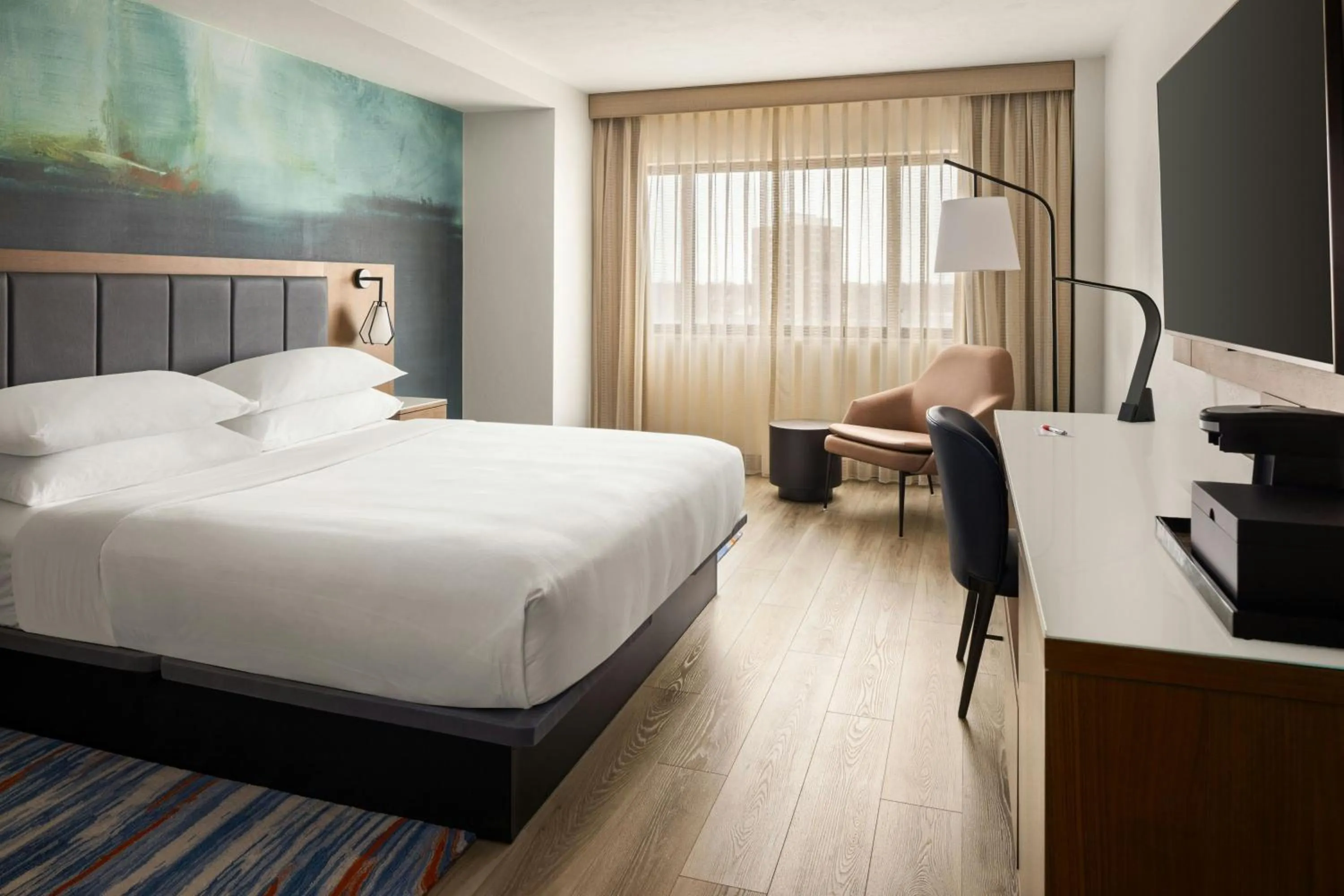 Photo of the whole room, Bed in Oshkosh Marriott Waterfront Hotel & Convention Center