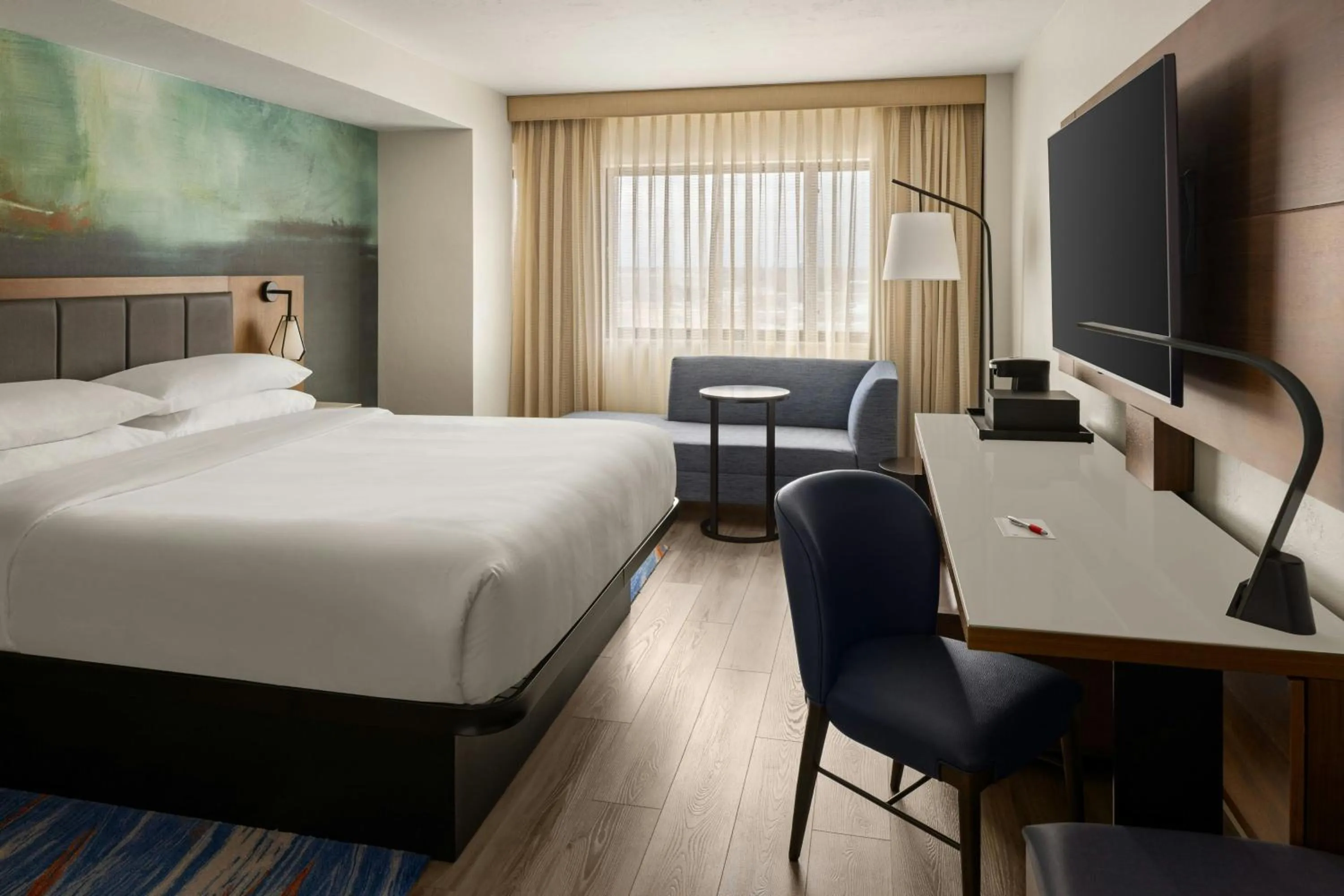 Photo of the whole room, Bed in Oshkosh Marriott Waterfront Hotel & Convention Center