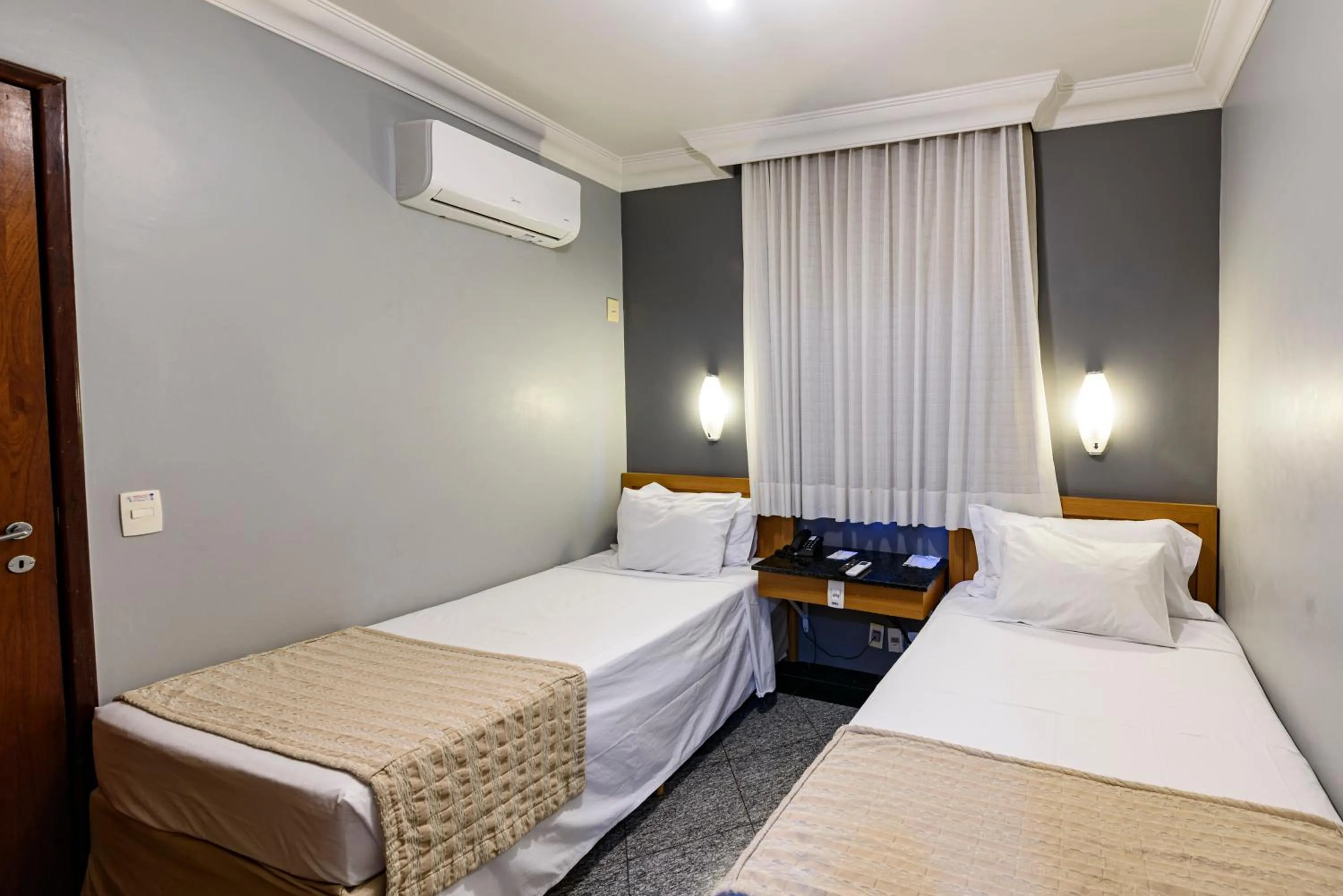 Bed in Plaza Inn Executive