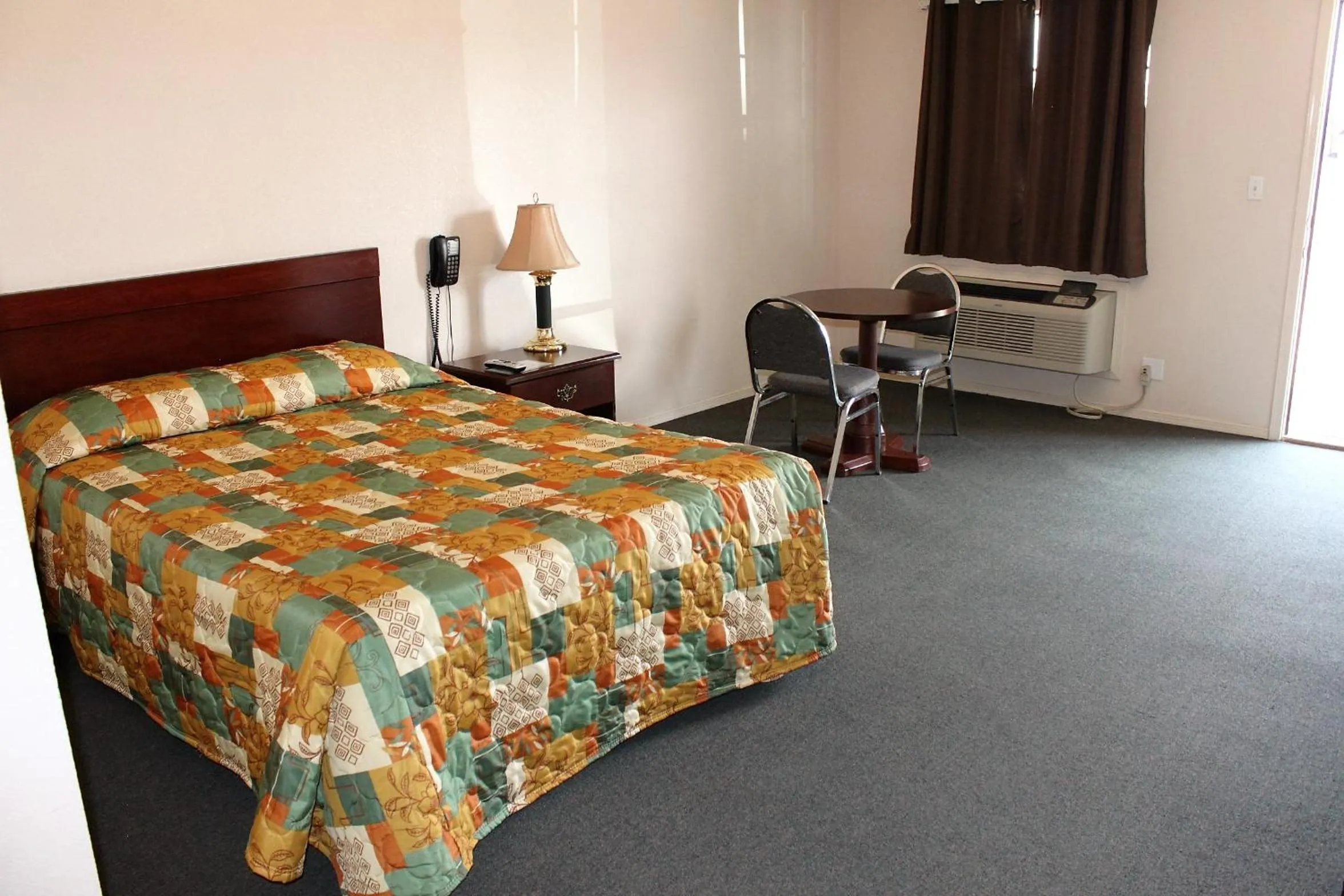 Bed in Adobe Inn Motel