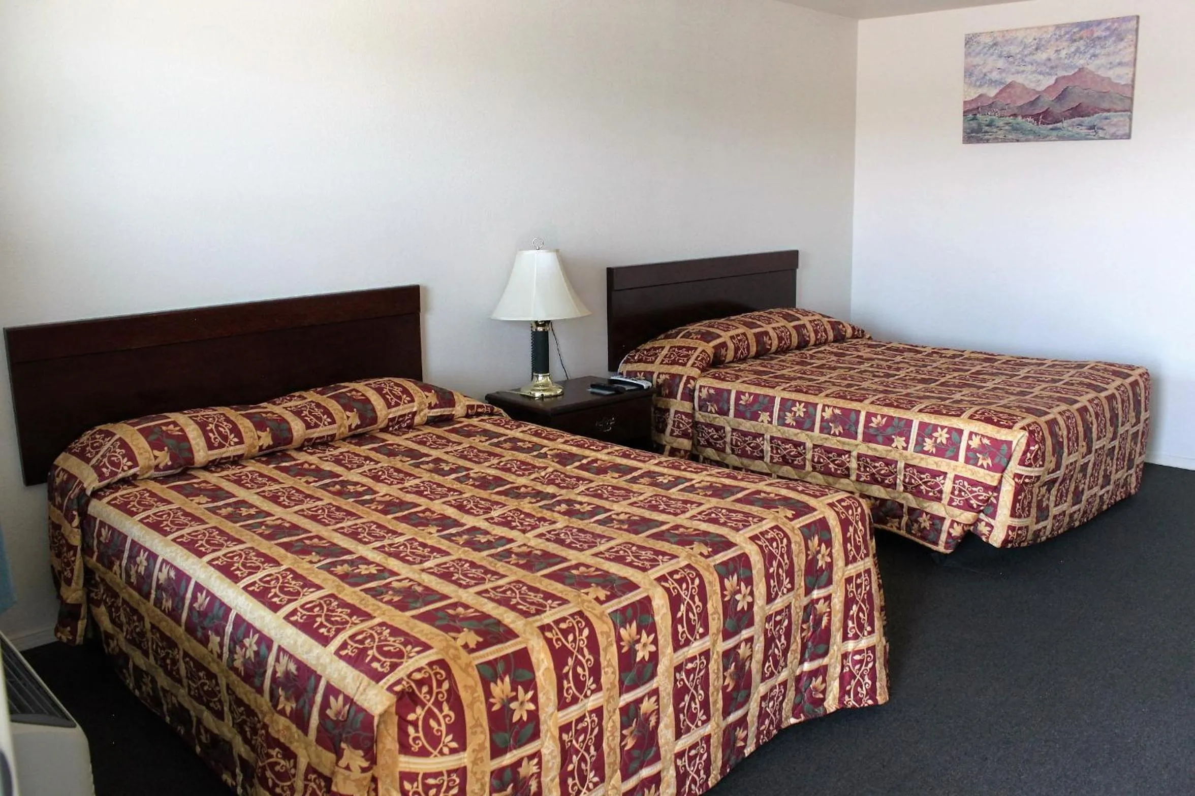 Bed in Adobe Inn Motel