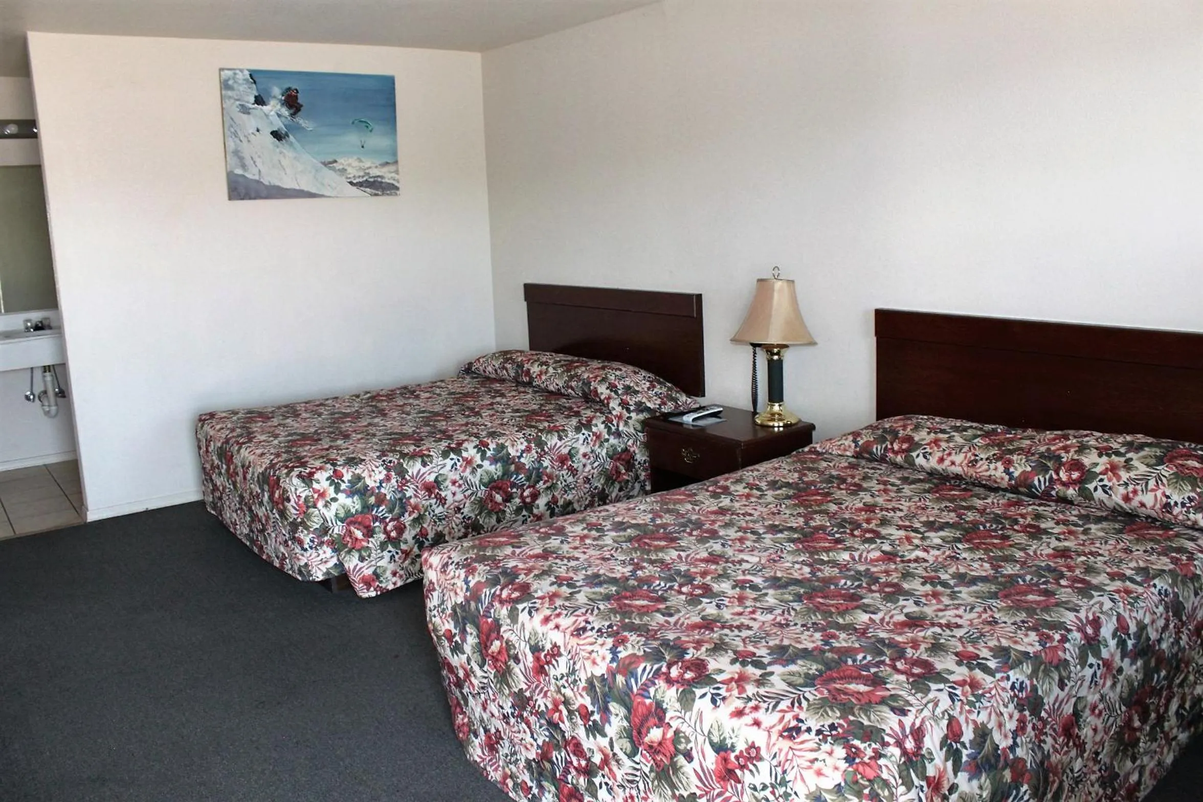 Bed in Adobe Inn Motel