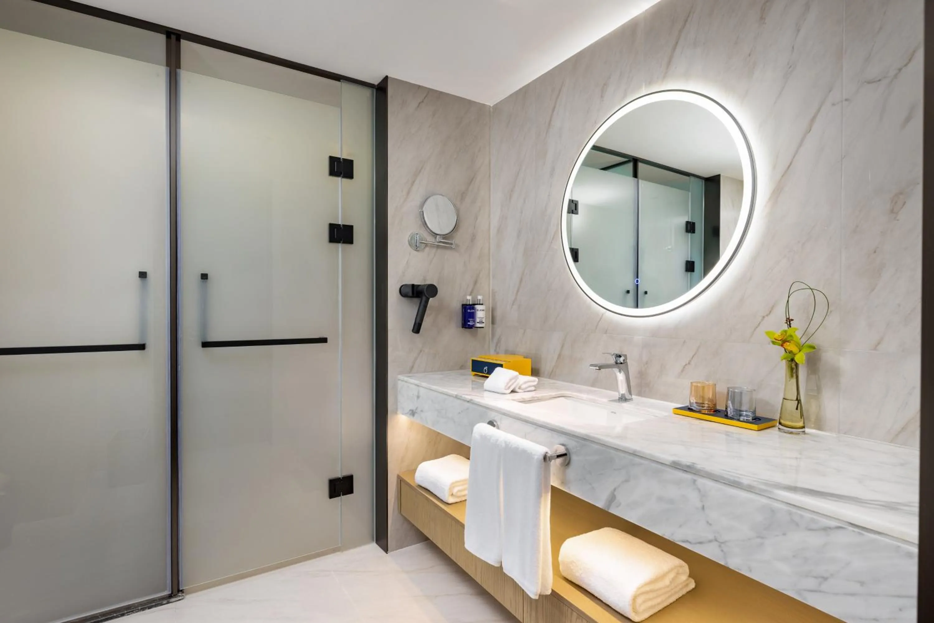 Bathroom in voco Suzhou Guanqian Street by IHG