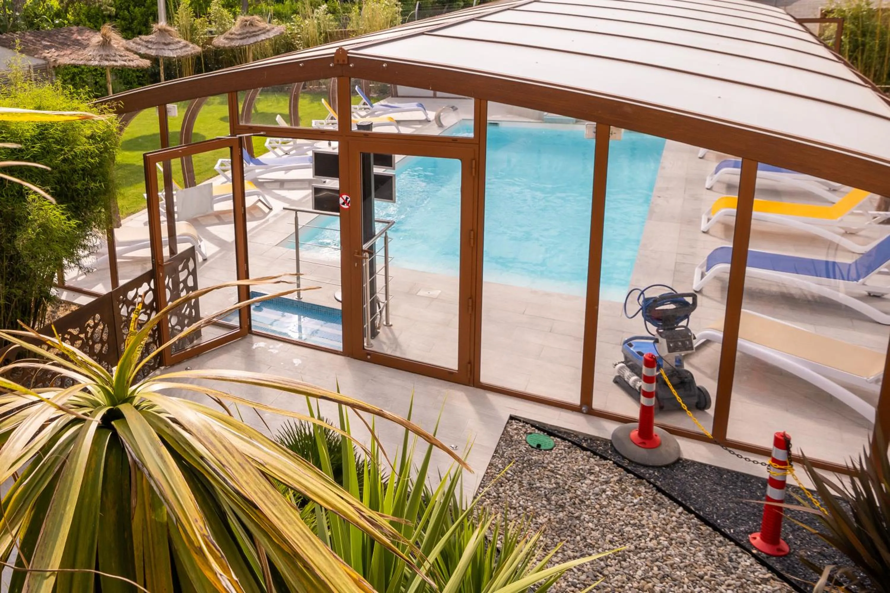 Swimming pool in LOGIS Hôtel Restaurant Le Clos Fleuri