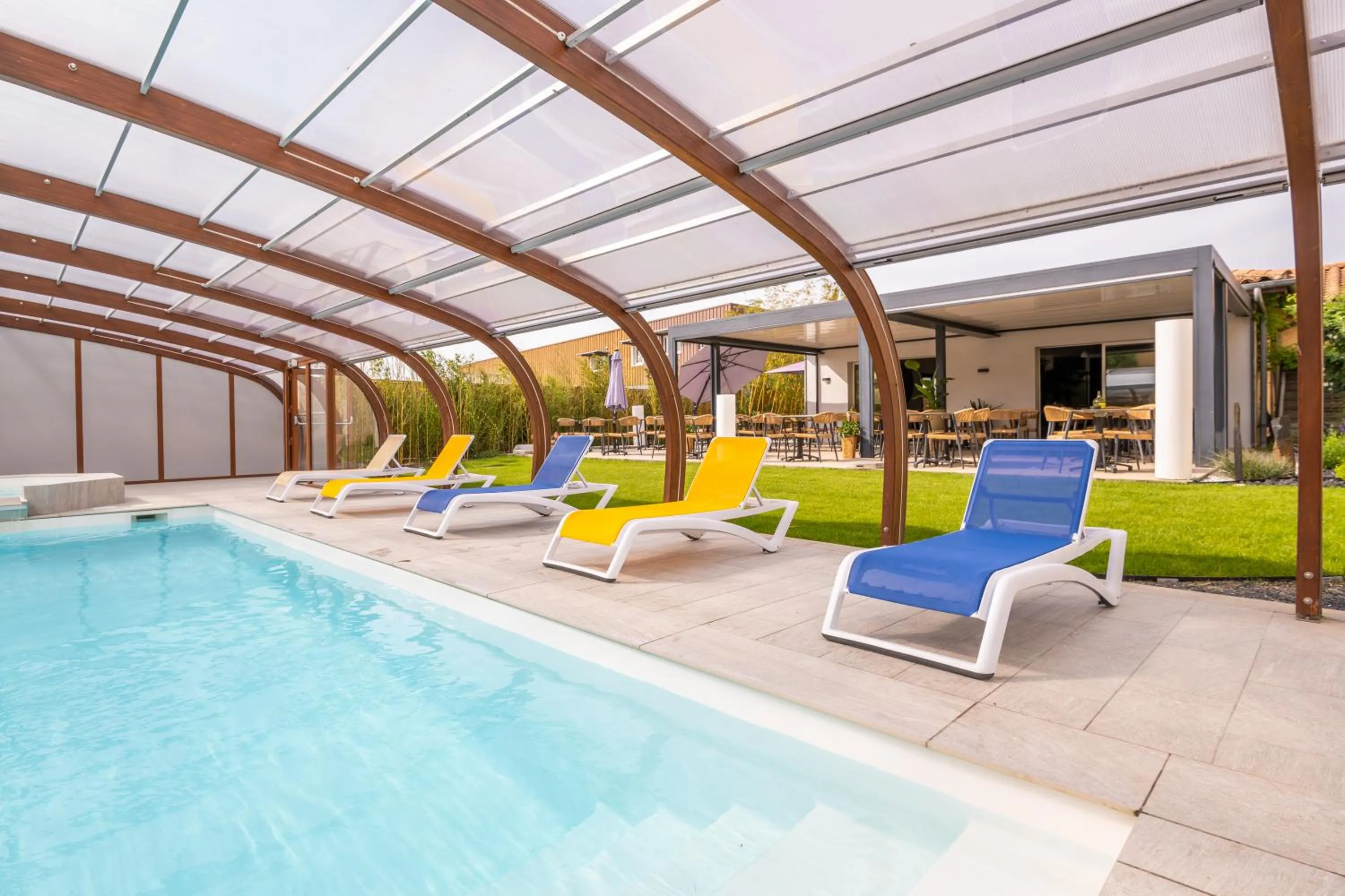 Swimming pool in LOGIS Hôtel Restaurant Le Clos Fleuri